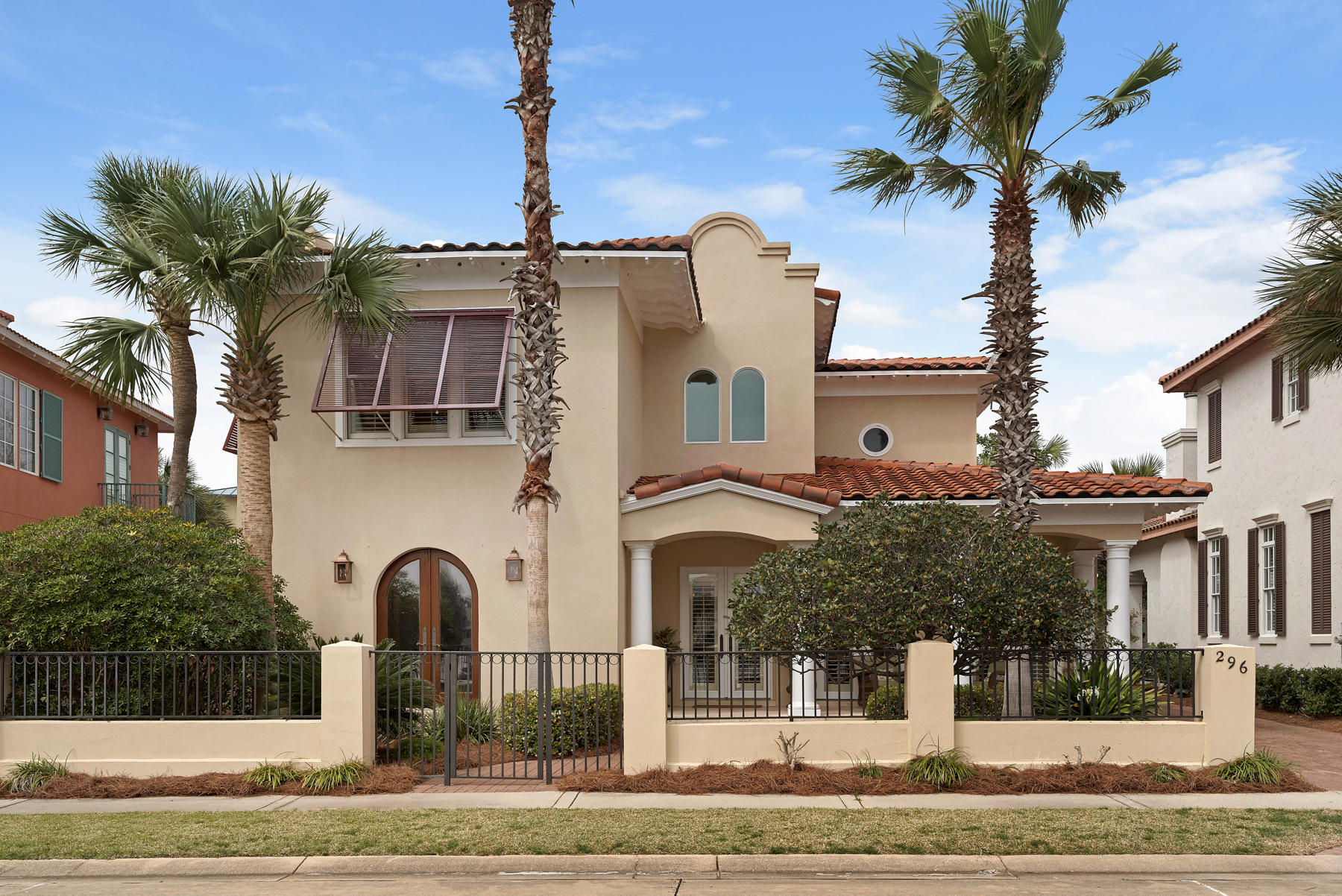 Picture cloudless days on Caribe's deep expanse of private beaches. Picture a newly updated, airy beach home just steps from the Gulf. Picture yourself in luxury and comfort at Les Antilles - 296 Rue Caribe. A wide front porch overlooking a private lake is meant for lazy days and neighborhood soirees. Inside, neutral colors, limestone flooring and intricately carved cedar doors delight the senses. Striking 10'' ceilings, French doors, tasteful light fixtures, and custom metal railings reflect today's style. Bright linens, French country accents, delightful new furnishings and a backyard ready for your custom pool simply make you smile. This open concept floor plan allows for main-floor living and total guest privacy. 296 Rue Caribe is sold completely and fabulously furnished. The luxurious main floor master suite is secluded from the main living areas but conducive to single floor living. An additional master suite is located upstairs as are two additional spacious bedrooms, all generously and luxuriously appointed and all with private baths. Les Antilles' spacious back yard is quiet and shady. Plans are included for your custom swimming pool to be installed. Caribe is a guard gated, private gulf front neighborhood conveniently located near Grand Boulevard in South Walton County. Caribe's private beaches offer daily chair service and endless sunsets. Two neighborhood pools, tennis courts, lush landscaping, Caribbean style architecture and friendly neighbors are included in low HOA fees. Caribe does allow vacation rentals of one week or more. While only about 25% of the homes are on the vacation rental market, the opportunity to realize income is an added bonus. 296 Rue Caribe generated $65,000 in rental income in 2017. Make an appointment to see this well-appointed home today. Consider Caribe as your next destination.