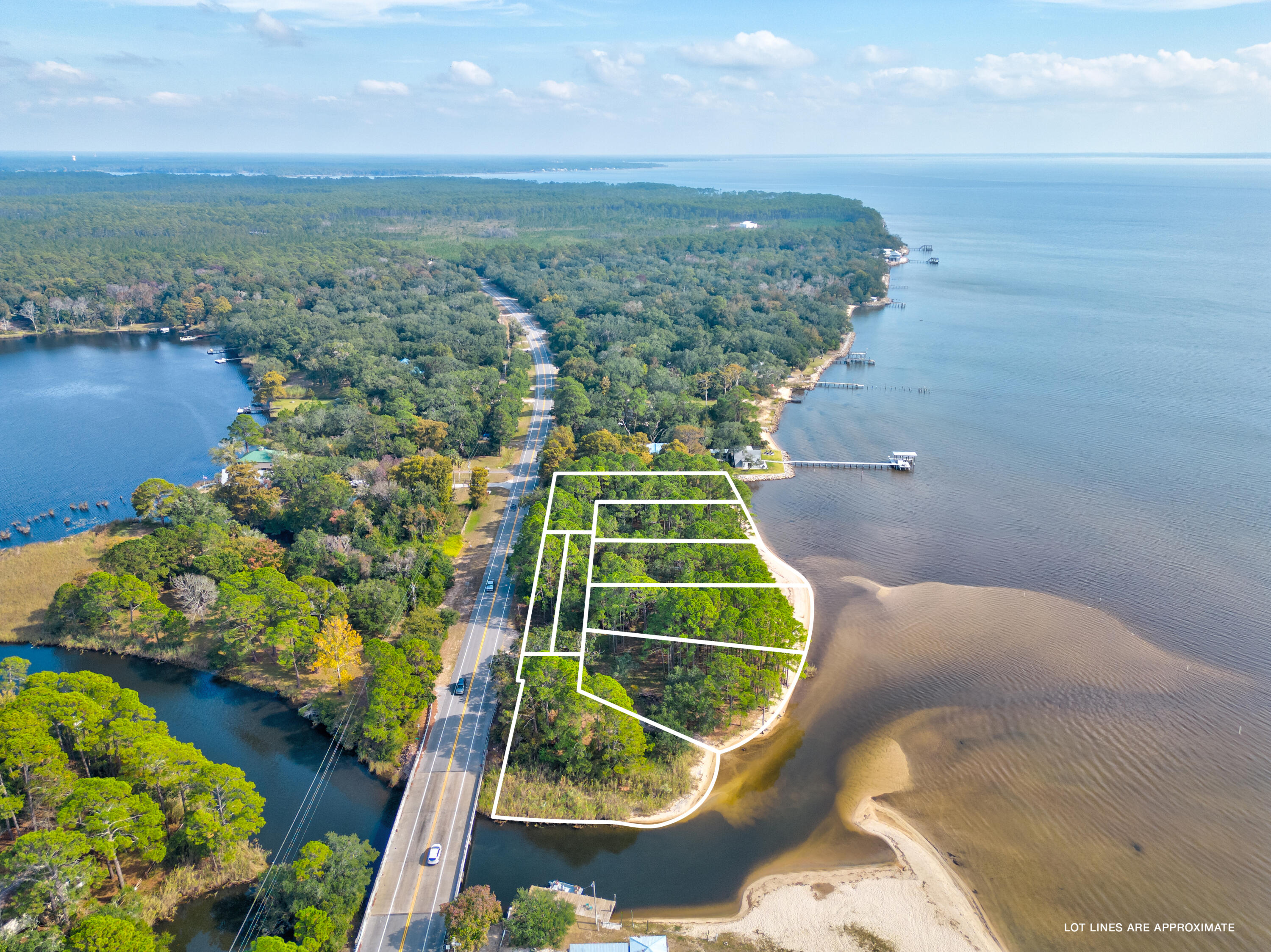 Reigning on over 700' of serene Bay frontage, the prime development opportunity of Basin Bayou Estates encompasses six homesites in the fastest growing county in all of Florida. Spanning from 0.33 to 0.62 acres, each estate sized homesite is strategically positioned to take full advantage of the famed Emerald Coast sunsets providing a new palate of mesmerizing hues each and every night. With preliminary clearing complete and an approved development order in place, this project provides a truly turn-key opportunity for investors and developers alike. Geographically poised within close proximity to the beautiful white sugar sand beaches and the plethora of world-class dining and entertainment venues the Emerald Coast has to offer. Inquire today and discover why Freeport remains one of North West Florida's most sought after areas for new development and full-time living.