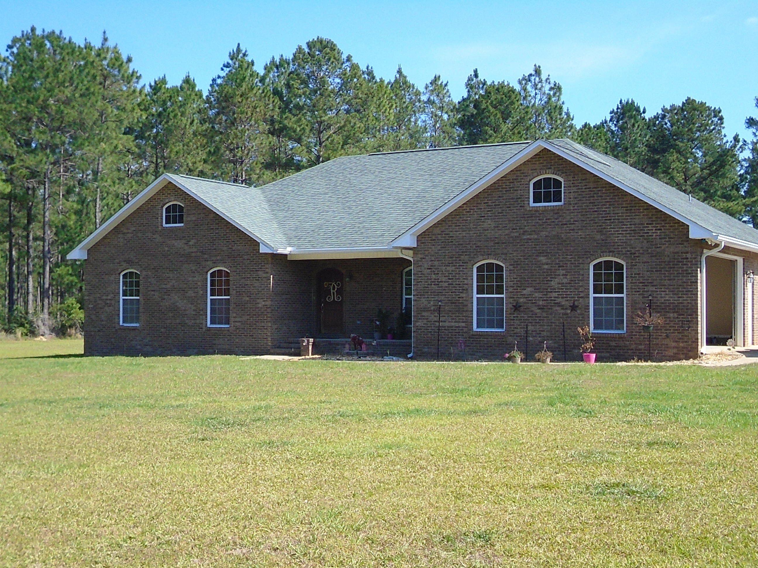 PERFECT COUNTRY SETTING 2300+ SQFT HOME OFFERS 4 BRS, 2 BA, LIVING, DINING, A HUGE SEPERATE PANTRY,A MASTER SUITE TO DIE FOR AND TONS OF OUTSIDE ENTERTAINMENT SPACE. HOME WELCOMES YOU WITH A COVERED FRONT PORCH THAT OPENS TO A LARGE OPEN FOYER. HOME HAS A OPEN FLOOR PLAN WITH SPLIT BEDROOMS. KITCHEN HAS ALL THE APPLIANCES YOUR HEART DESIRES AS WELL AS A BREAKFAST BAR AND TONS OF CABINETS AND COOKING SPACE. THE LIVING OPENS TO COVERED PORCHES AND ALSO CONNECTS TO THE DINING ROOM - GREAT FOR FAMILY NIGHT! THE MASTER OFFERS A HUGE WALK IN CLOSET, AMAZING MASTER BATH AND SAFE ROOM BEHIND ONE WALL TO PROTECT ALL YOUR PERSONAL BELONGINGS. HOME SITS ON 5 ACRES WITH ADDITIONAL LAND AVAILABLE. PROPERTY HAS HUGE 30X72 WORKSHOP, BUILT IN SECURITY ALSO.