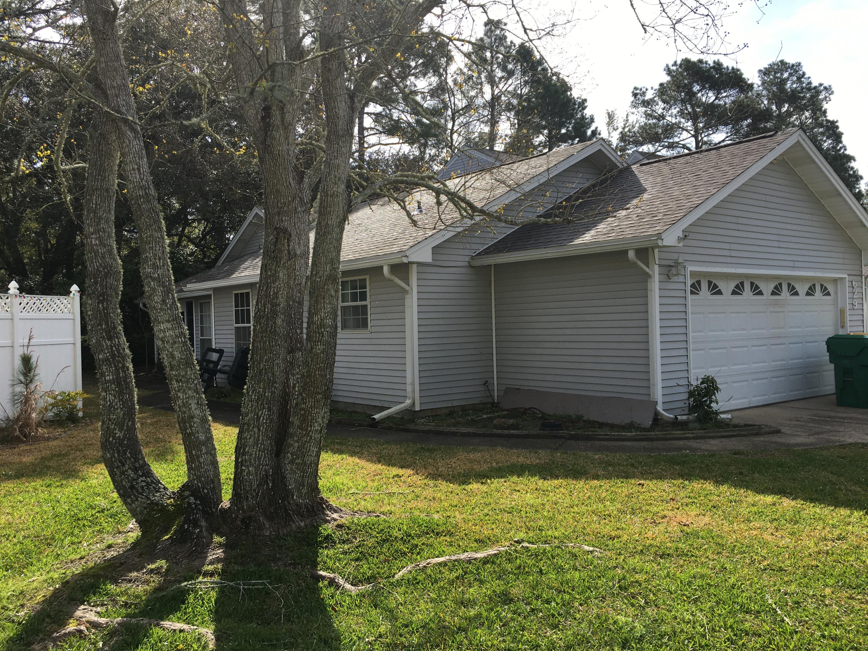 This spacious unit features three bedrooms and two baths ALL in one story. The attached town home is an end unit with an open living/dining area with vaulted ceilings. Just outside the living room is a a screened in patio that overlooks a green wooded area. The community pool is just out the door and a few lots down. Lawn care, roofs exterior maintenance and termite control is included in the HOA fees. With a two car garage. With a little spackling and paint, this home could be your castle. ! This is an estate sale and the Personal Representative has very limited knowledge of any history of the property.