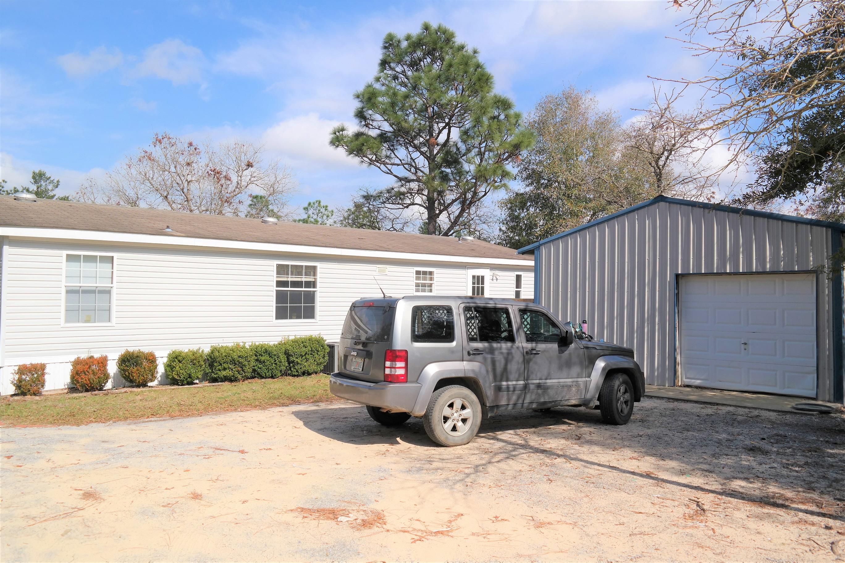 What a great place located in the Mossy Head area of Defuniak Springs! Home sits on apx. 1 acre, with road frontage on Tulip Ave and Crocus. There is a 20x20 shop; open decks on front and back; Covered RV parking; chicken house and fenced area for your pets. New HVAC installed in 2016 and currently under a maintenance contract through One Hour H&C. All appliances (including washer/dryer) included in sale! Walk in closets in all bedrooms. Master bath has garden tub, double vanities and separate shower. Also, wood burning fireplace, open floor plan, generous laundry room. Schedule your showing today!