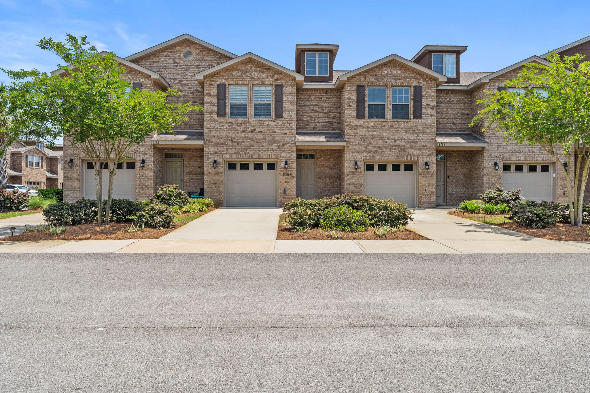 Come see this upscale townhome located in the back of the desirable Reserve Pointe for added privacy.  This  3 bedroom 2.5 bath has MANY new upgrades such as an A/C air filter system,  a vinyl privacy fence surrounded by beautiful flowers with fresh sod, pull out stainless steel drawers in kitchen, and bathrooms, stainless steel refrigerator with warranty, beautiful luxury vinyl flooring and carpet throughout, all walls have been freshly painted, plantation shutters, front storm door, barn door in the master bedroom, mud room and storage under stairs and wainscoting through out the home.  Check out the list of upgrades under the documents section.  The family friendly amenities include a pool, picnic tables and a play area.  Reserve Pointe is minutes from the best beaches in the world.