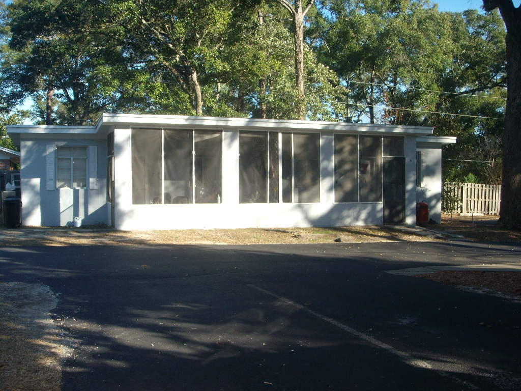 COZY COTTAGE LOCATED 2 BLOCKS EAST OF MARY ESTHER BLVD. TILE FLOORING. 

NEW LOWER KITCHEN CABINETS, STOVE & REFRIGERATOR. 

CONVENIENT TO EVERYTHING. 

SCREENED PORCH FOR RELAXING. IDEAL FOR SINGLES OR COUPLE. SECURITY DEPOSIT INCLUDES NONREFUNDABLE CARPET CLEANING FEE. SORRY - NO PETS ALLOWED! NO WATER ACCESS. OWNER IS REGISTERED REAL ESTATE BROKER