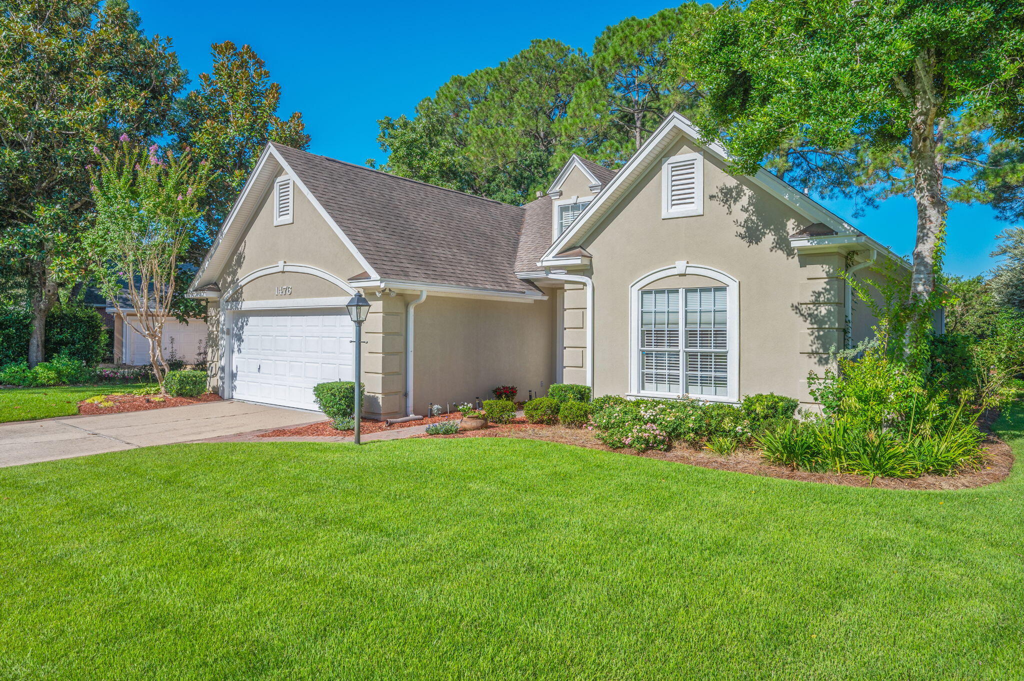 Bluewater Bay living at it's BEST!!!
Welcome to 1476 Oakmont Place—a beautifully maintained, single-story home located in the highly desirable Bluewater Bay community. Nestled along the 7th hole of the Bluewater Bay golf course, this residence offers luxury, location, and low-maintenance living.  Just a short walk to enjoy beautiful sunsets over Choctawhatchee Bay and quick access to Destin!
Step inside to find updates galore, with Australian cypress hardwood flooring throughout the main living areas and home office (or 3rd Bedroom).  The spacious living room features a cathedral ceiling, crown molding, a cozy gas fireplace, and custom drapes paired with high-quality 2-inch wood blinds. The kitchen is stunning, complete with custom cabinetry, quartz countertops, and stainless-steel appliances.  The convenient laundry area is a fantastic transition area featuring a pantry closet & gas hookup (for a dryer).  The open floorplan flows easily past the breakfast bar and through the dining area to an upgraded Florida room!  This space is an ideal spot for morning coffee or relaxing after a long day while overlooking your GORGEOUS back yard.  
Retreat to the luxurious primary suite featuring a tray ceiling, bay window, oversized walk-in closet with upgraded shelving and drawers.  The ensuite bathroom is an ideal layout with walk-in shower, rainfall showerhead, and a WALK-IN linen closet.
Additional highlights include:
o	Exceptional floorplan with LOTS of storage
o	Guest bath with glass-enclosed tub/shower combo
o	Finished two-car garage with premium floor coating, cabinetry, fast-track hooks.
o	HUGE "standing height" attic with carpeted floors, extra shelving, and easy access to the gas furnace.
o	Beautifully landscaped yard with irrigation system
o	Roof (2013), HVAC (2018), Water Heater (2021)
o	Pre-inspection completed, termite bond with Terminix, and insurance quotes available
This move-in ready home combines function, elegance, and peace of mind, all within one of Niceville's most sought-after neighborhoods.  You'll really love living here...Schedule your showing today!!