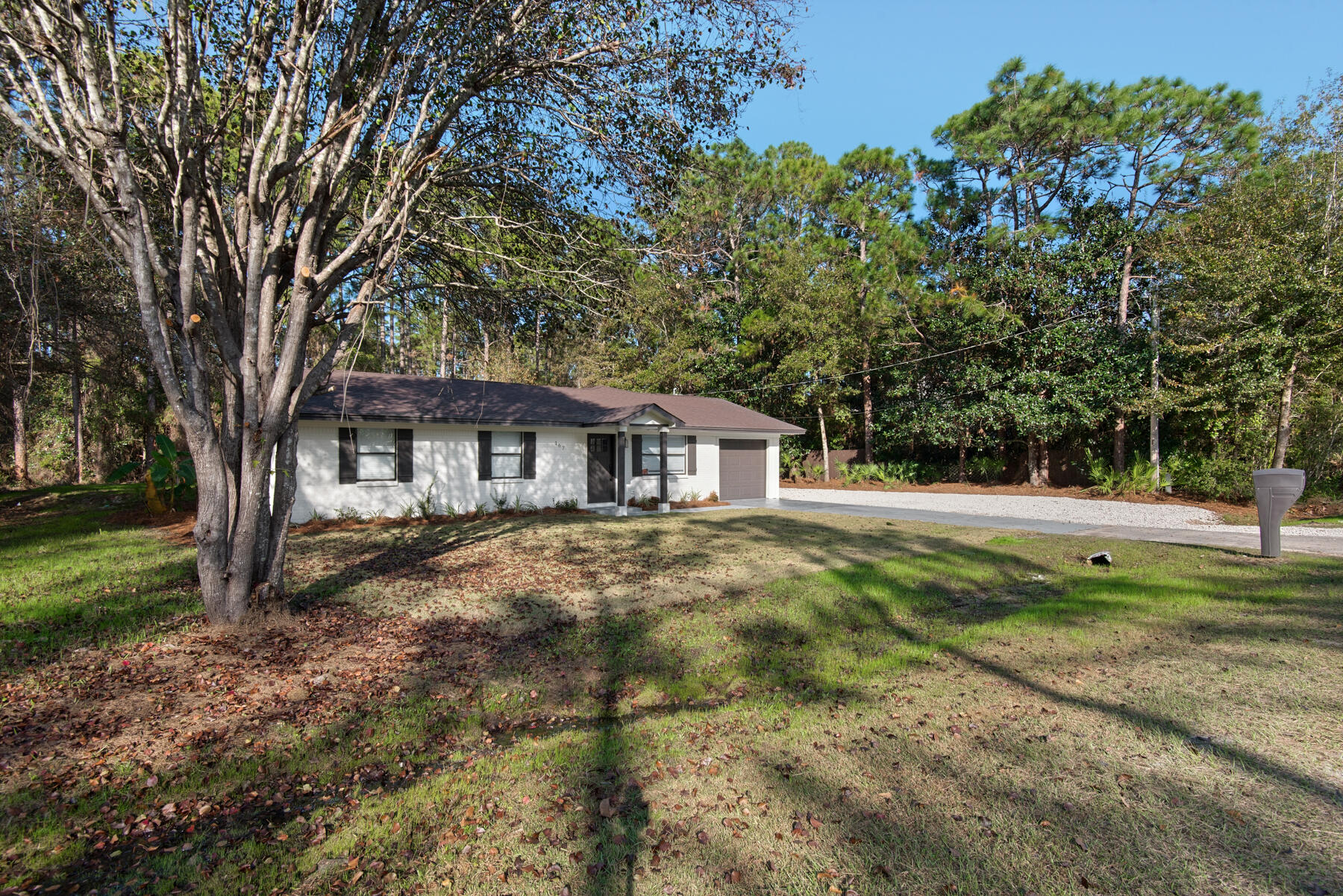 Adorable and affordable 4 bedroom, 2.5 bath home on an oversized lot in the popular Santa Rosa Beach area. This home has recently been completely remodeled, from top to bottom, including a brand new kitchen, new bathrooms, new HVAC system and the addition of a half bath and a one car garage. Luxury vinyl plank flooring throughout, custom tiled showers, shaker style cabinetry, stainless steal appliances and granite countertops are just a few of the many upgraded features of this beautiful home. Boasting an open floor plan perfect for entertaining, the kitchen and large breakfast bar overlook an enormous great room and back yard with plenty of room to add a large pool. Need extra parking for an RV or boat? We've got your covered! There is a large gravel parking pad on the side of the house and no HOA to govern what you can put there. Call today to see this gem!