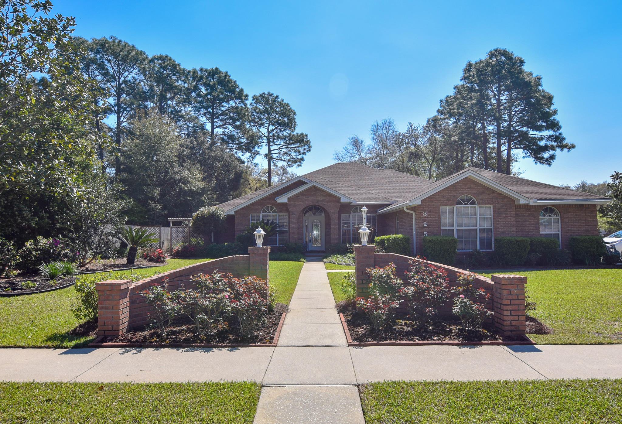 Impressive - all brick - family home in Rocky Bayou Estates. Split floor plan with 4 bedrooms, office/den and 3.5 baths. Large corner lot (.43 acre). Professionally landscaped yard front and back. Pleasing foyer entry. Tall and bright inside with many nice appointments including crown molding and custom lighting. 2 living areas. Big open kitchen with new granite counters/sinks, maple cabinetry, newer stainless appliances and walk in pantry. Center island with power. Large master bedroom & bath. Guest suite with full bath. Florida room leads out to screened patio. Big 3 car garage with refinished ceiling. New roof in 2017. 2 new hot water heaters in 2015. New HVAC system in 2015 with UV sensor. New attic ducting in 2018. Pride of ownership inside and out. A must see property!