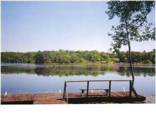 HUGE PRICE REDUCTION on this Waterfront lot on Juniper Lake. Beautiful open lake view of Juniper Lake. Lake is said to be 670 acres with large mouth bass, bluegill and catfish. Dock on lake for fishing. Also includes a storage shed. City water with tap fee PAID. Septic tank and power pole are as-is. Property is ready for new home, new manufactured home or a perfect place to visit with your motor home.
