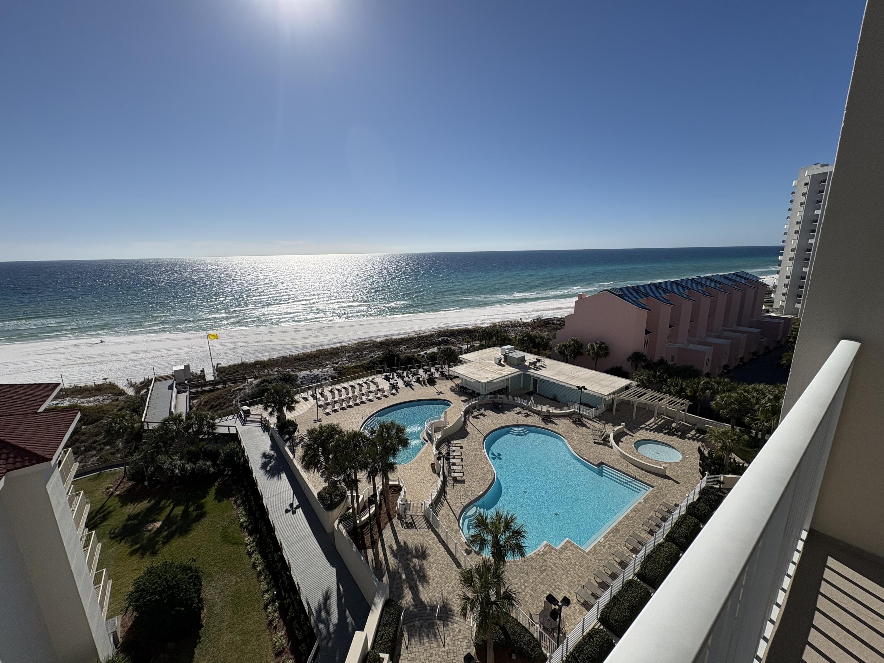 Experience the ultimate in coastal living at Tides 702! This stunning 2BR/2BA gulf-front condo boasts sweeping views of emerald waters and sugar-white sands from your private balcony—a front-row seat to paradise. Nestled within the prestigious Tops'l Beach & Racquet Resort, you'll enjoy resort-style amenities, including a beachfront pool.  Perfectly situated near world-class dining, boutique shopping, and championship golf courses, this property is an idyllic retreat or a savvy real estate investment opportunity. Don't miss your chance to own a slice of beachside heaven—schedule your tour today!