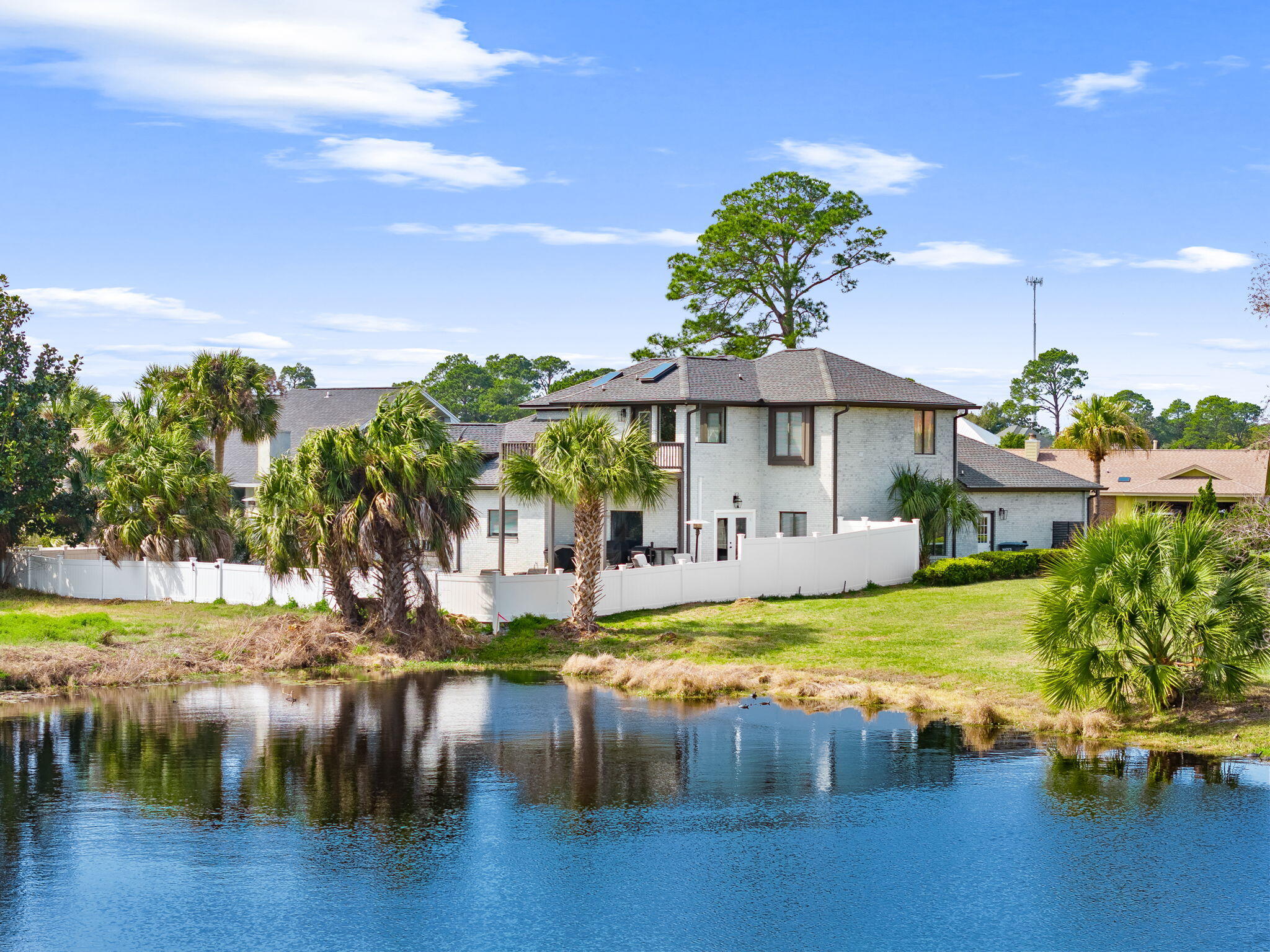🥃 Bourbon Lounge. Sports Theater. 1,140 sq ft entertaining patio. Welcome to one of Bay Point's most compelling opportunities. This fully remodeled 4BR/3BA residence offers 2,913 sq ft of upgraded coastal living designed for those who love to host. Renovated in 2019--including roof, electrical, lighting, appliances, dual HVAC systems, and two water heaters--the home combines major infrastructure improvements with curated style throughout. Features include brand-new custom closet systems, upgraded cabinetry with pull-out storage, strategic dimmable lighting, a new ice maker that conveys, and a premium on-tap seltzer faucet option. The flexible layout includes a first-floor primary suite, an expansive upstairs owner's suite with private balcony, and mezzanine bonus space ideal for an office or lounge. Conveniently located within Bay Point with easy access to both community gates, the home still enjoys the privacy and prestige of this gated golf and marina community. Rarely does a Bay Point property with this level of renovation and entertaining infrastructure become this attainable. Seller is ready for offers.