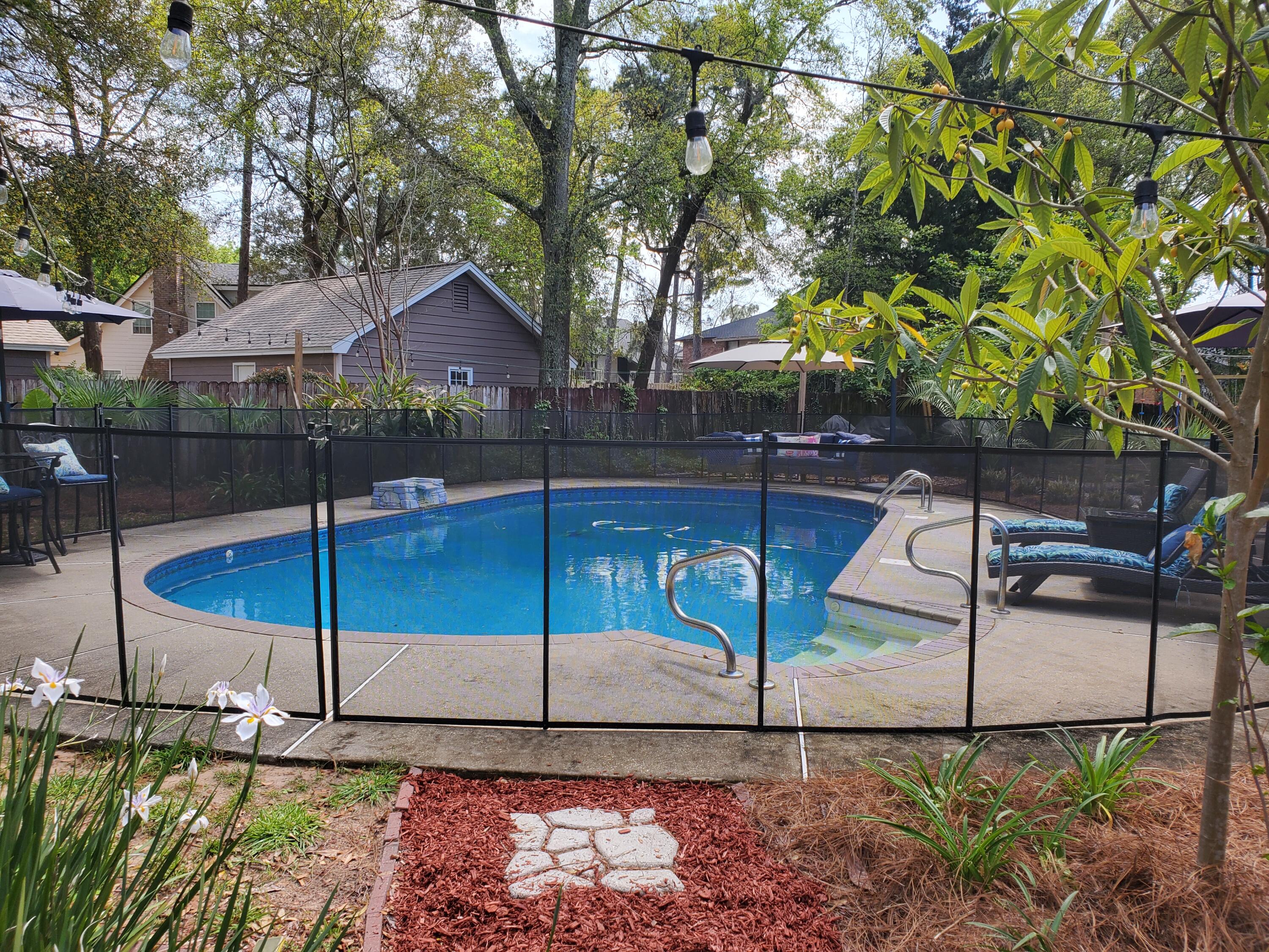 WOW!!!  This home has it all!!  Beautifully updated spacious home on a large lot situated at the end of a cul de sac with fully remodeled kitchen and bathrooms! NEW roof in Feb 2022, solar panels that will be paid off at closing, and a new pool liner March 2020! The wood look tiles will Wow you as they create a nice flow throughout the home.   Relax in the spacious family room as well as in the huge FL room that overlooks the beautifully lush backyard, sparkling saltwater pool, gazebo and outdoor kitchen/dining space with outdoor TV!  The large dining room has room for all and an additional bonus room off the kitchen is perfect for an office, kids play area, yoga studio..the possibilities are endless!  Enjoy peace of mind with a  safety fence around the pool in addition to the privacy fen fence along the perimeter of the property. The driveway allows for extended parking and a storage shed offers plenty of storage space for all your lawn and garden equipment.   This home has underground utilities and is on the same power grid as the Pensacola airport....so, if the airport ever loses power, rest assured that you too will enjoy being among the first in the area to have power returned after a major storm!  This home has been beautifully updated and maintained and is now just waiting for YOU!  Welcome Home to Paradise!!