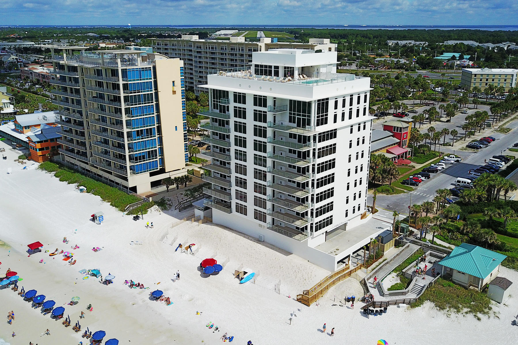 1900 Ninety Eight is Destin, Florida's first Gulf front condominium developed since 2007. Each exquisitely designed luxury residence features a panoramic view of the Gulf of Mexico from its private, 12-foot deep balcony equipped with an electric grill. The open plan with clean, flowing lines invites beams of natural light inside through an expansive wall of windows. Interior design elements that include custom cabinetry, marble and quartz countertops, Thermador kitchen appliances and porcelain stone floor tile makes this three bedroom, three bath residence truly incredible. Amenities include a rooftop pool, spa, fire pit & state of the art fitness center, along with gated entry, heated and cooled elevator and lobby areas and two levels of parking beneath the residences.