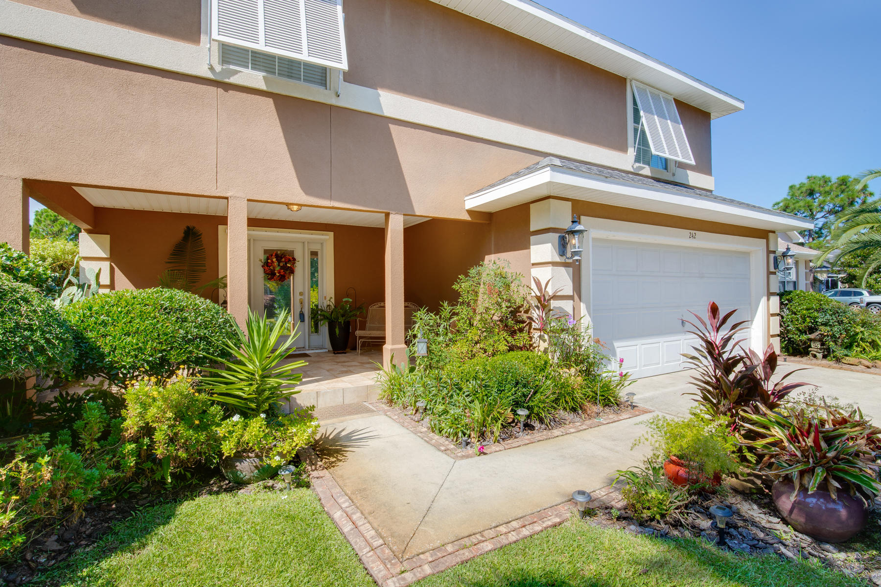 This beautiful home boasts a large open floor plan w/ soaring ceilings, tons of storage, bonus loft area and heated/cooled Florida Room. Enjoy gorgeous citrus trees, mature landscaping, and lake views from this well-kept retreat. You will find wood-look tile throughout the Living Area and Master Bedroom as well as a tiled back splash and bar wall. Equipped with Hurricane Shutters/Panels, window blinds throughout, and anti-glare film (downstairs), you'll have protection from the elements while enjoying the option for tons of natural light. The gated neighborhood has fishing ponds, scenic/shady walking paths, a community park/pool/tennis courts/playground and is just minutes from the beach and all the best shopping and restaurants Destin has to offer. Call for a private showing today!