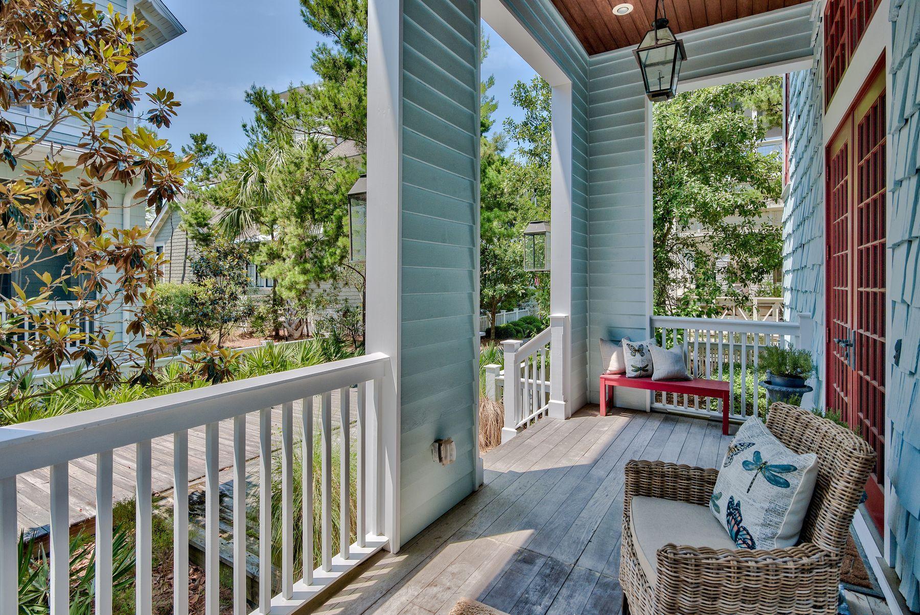 Located in the exclusive gated community of Water Sound Beach, this five-bedroom home sits on a well-positioned corner lot. The shingle-clad property shares the lot with a detached garage and private courtyard with pool. The moment you step inside this 3,546 square-foot property you'll appreciate the space. Take note of the gorgeous walnut flooring and the newly refreshed dcor by Laura McKee of Dwell Interiors. The custom finish is enhanced by airy 13-foot cathedral ceilings with crown molding and exposed rafters on the first floor. This level also includes a master suite. The open plan great room is enhanced by custom built-in bookcases and full-height windows that flood the room with natural light. It provides a comfortable, elegant ambience, whether you're home alone or entertaining on a grand scale. French doors open onto the secluded pool area designed for spending time outdoors with its summer kitchen and outdoor fireplace. The newly remodeled all-white kitchen will inspire anyone who enjoys cooking. The design includes plenty of easy-to-access drawer storage, stylish quartz countertops, a sail-shaped island for casual dining and a walk-in wine cellar. Walk up the angled staircase to four further bedrooms and access to the covered balcony - a quiet space to read and reflect. With a state-of-the-art fitness center and host of amenities, WaterSound Beach provides an enviable lifestyle in an exclusive beach community. The sunny outdoor life beckons with seven miles of boardwalks and walking trails connecting community pools, children's park, puttering green and dog park. Neighboring Deer Lake State Park is an unspoiled area for hiking, bicycling, fishing and kayaking while beach lovers have access to a full mile of stunning white sand and warm gulf waters for swimming and shelling.
