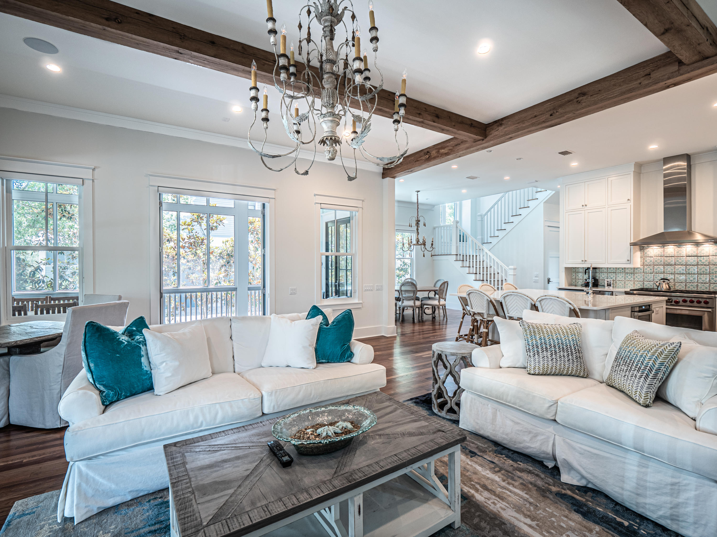 Sitting on a leafy corner lot in coveted WaterColor III, this attractive five bedroom, five and one-half bath
home has a plethora of above-average features and upgrades. White walls and tall
windows create a bright living space warmed by gleaming walnut flooring and a feature fireplace. The newly fitted gourmet kitchen is the natural hub of
the home with hand-painted tiles and a full range of Wolf and Sub-Zero appliances.
The family sized island is designed for serving chips and dip, casual dining or perching on stools and hanging out with the chef. Start each new day in the breakfast
nook which opens onto a screened porch. Read the newspaper on the swing, listening
to the sound of birdsong in the surrounding greenery. Bedrooms are filled with natural light and include a ground floor guest suite and a bunk room on the second floor for young guests to hang
out and play in their own separate haven. Screened porches on the first and second floor provide a series of quiet
spaces for socializing and relaxing in the dappled shade. Above the two-car garage, the self-contained carriage house is finished to the same high standard for welcoming guests. With 9 community pools, miles of hiking trails, tennis, pickleball, kayaking and stand-up paddleboarding, WaterColor is all about living life to the fullest.