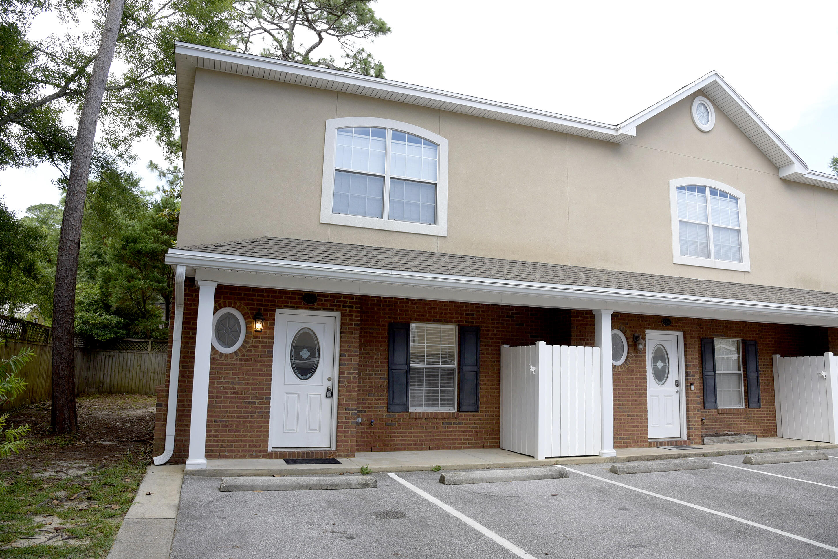 Wow! This end unit townhome has all the bells and whistles. Stainless upgraded appliances in kitchen, granite counter tops, tile flooring and upgraded deep carpet. Kitchen features side by side stainless refrigerator with ice and water in the door and built in microwave. Tile flooring throughout the downstairs, carpet in the bedrooms. Downstairs features spacious living area, half bath, indoor laundry area, back porch and storage room. Bedrooms are upstairs with two full baths. Little yard work! All electric unit. Sorry no pets allowed. No Smoking