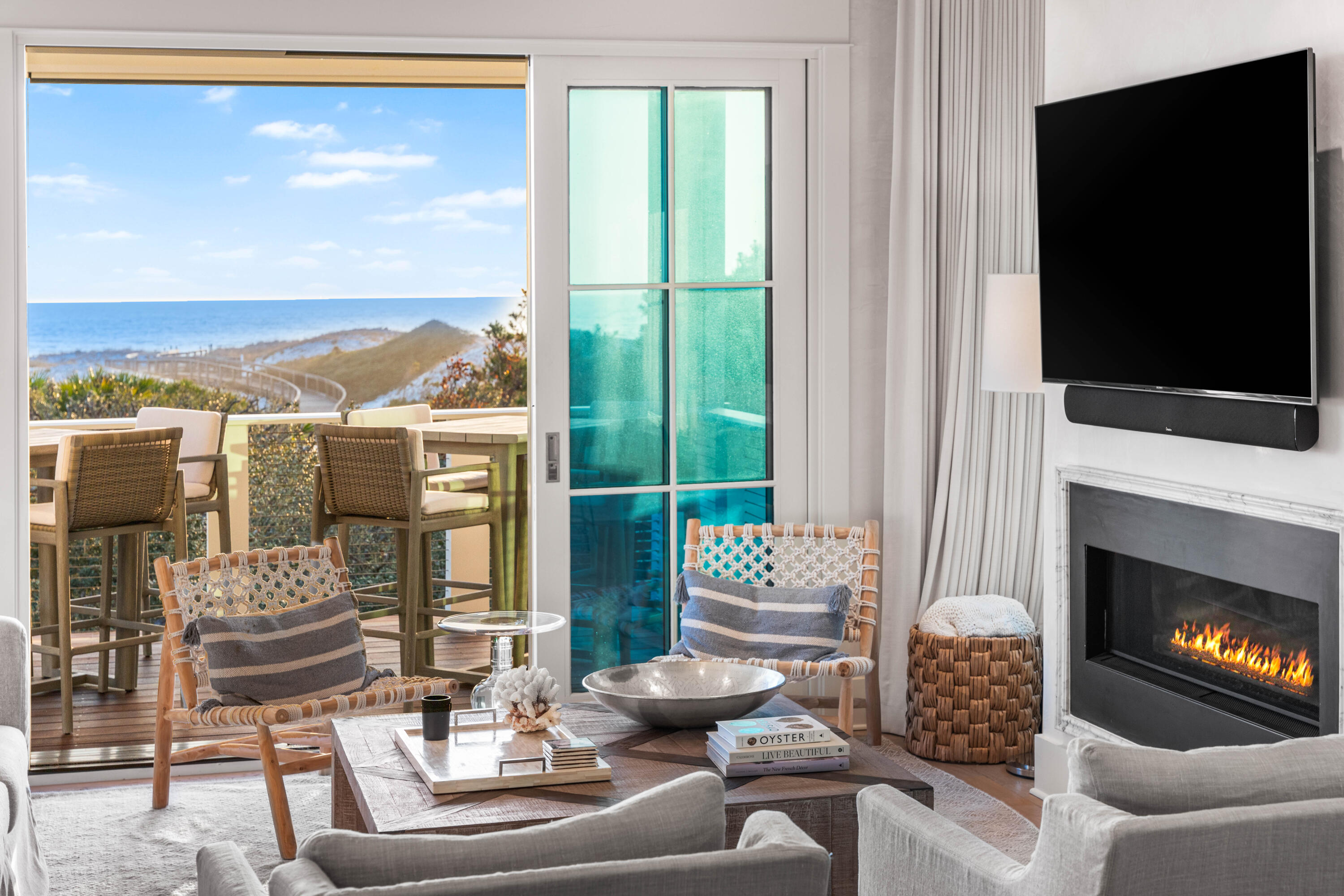 Draped amongst the stunning dunescape of WaterSound Beach, discover an exquisite gulf front masterpiece at 101 S Founder Lane offering timeless elegance and unmatched luxury. Expertly crafted by Regal Stephens with sophisticated design by Tracery Interiors, this 6-bedroom, 6.5-bathroom residence, complete with a private pool, 2-car garage, and office/flex room, offers a rare blend of refined craftsmanship and stunning coastal views. Sold fully furnished and never rented, this exceptional property is positioned on a quiet cul-de-sac, providing privacy and direct access to the beach via community boardwalk.
Step through the entry, where herringbone-laid hardwood floors and Venetian plaster walls set a tone of understated luxury. This level includes three spacious bedrooms, each with private ensuite bathrooms, and a well-appointed laundry room featuring dual Electrolux washer/dryers. An elevator provides seamless access to all floors. Outside, relax by the saltwater heated pool sheltered by the dunes, enjoy the summer kitchen with a beverage cooler and ice machine, and take in the serene and private setting.
The heart of this home lies on the second floor, where an open-concept kitchen, dining, and living area showcase breathtaking gulf and dune views. The chef's kitchen is equipped with professional-grade appliances, including a Wolf range, custom hood, and Sub-Zero refrigerator and wine fridge, all set off by marble countertops, a marble waterfall island, and custom cabinetry. A walk-in pantry with a secondary refrigerator enhances convenience. The living room's gas fireplace with a marble surround adds warmth and elegance while a spacious balcony with retractable screens offers a perfect spot to enjoy the view, shaded from the afternoon sun. This level also includes a light-filled office/flex room with closet space, a powder room, a unique guest suite/bunk room with six built-in twin bunks, a queen bed, a living area with a TV, morning bar, and private bathroom, along with a junior master suite featuring an elegant ensuite bathroom.
The entire third floor is dedicated to the magnificent master suite, where panoramic gulf views create an idyllic sanctuary. Custom built-ins including wardrobe drawers and a half wall, a morning bar, and a spacious ensuite bathroom with a steam shower, soaking tub, and washer/dryer, make this a true retreat. The custom closet offers abundant storage and thoughtful design. Crowning this luxurious home is a fourth-level tower with both indoor and outdoor spaces to enjoy. This top-floor retreat features remote-control blinds, a retractable TV, and an open-air balcony with a fire table, offering endless views and the ultimate in relaxation.
The gated WaterSound Beach community is located south of Scenic Highway 30A offering homeowners a rare sense of seclusion yet with easy access to area activities. Amenities include swimming pools, a puttering park, community green spaces, a state-of-the-art fitness center, and private boardwalks to one of the most beautiful mile stretches of coastline in the area. Whether you're seeking a luxurious private retreat or a potentially lucrative investment property, revel in the good life at this one-of-a-kind WaterSound Beach residence.