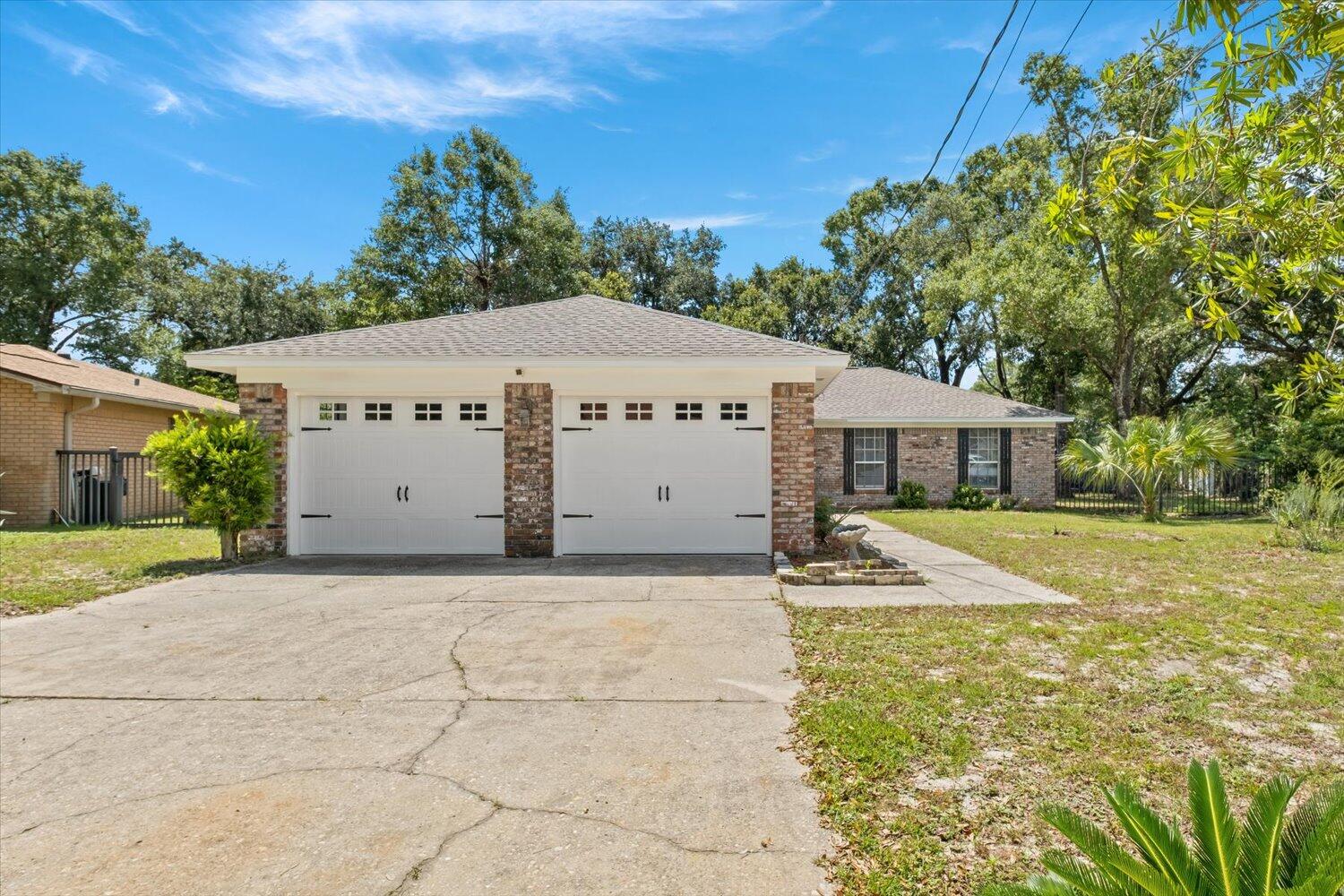 Property was a complete renovation in 2022 and is 100% ready for a new owner. Since the renovation, a back sliding glass door and wood patio was added in so that there was an extra entranceway to the backyard and give more natural light to the already abundant natural light in the home. Wood burning fireplace in living room, wide-open floor plan, all new light fixtures, all new LVP flooring and tile in bathrooms, countertops in all wet areas are new granite, new roof, new electrical, water heater and HVAC are both less than 3 years old. The white sand beaches are a short drive away and the Naval Air Station Pensacola is 5.4 miles away. Call today for your private tour or with any questions about this property.