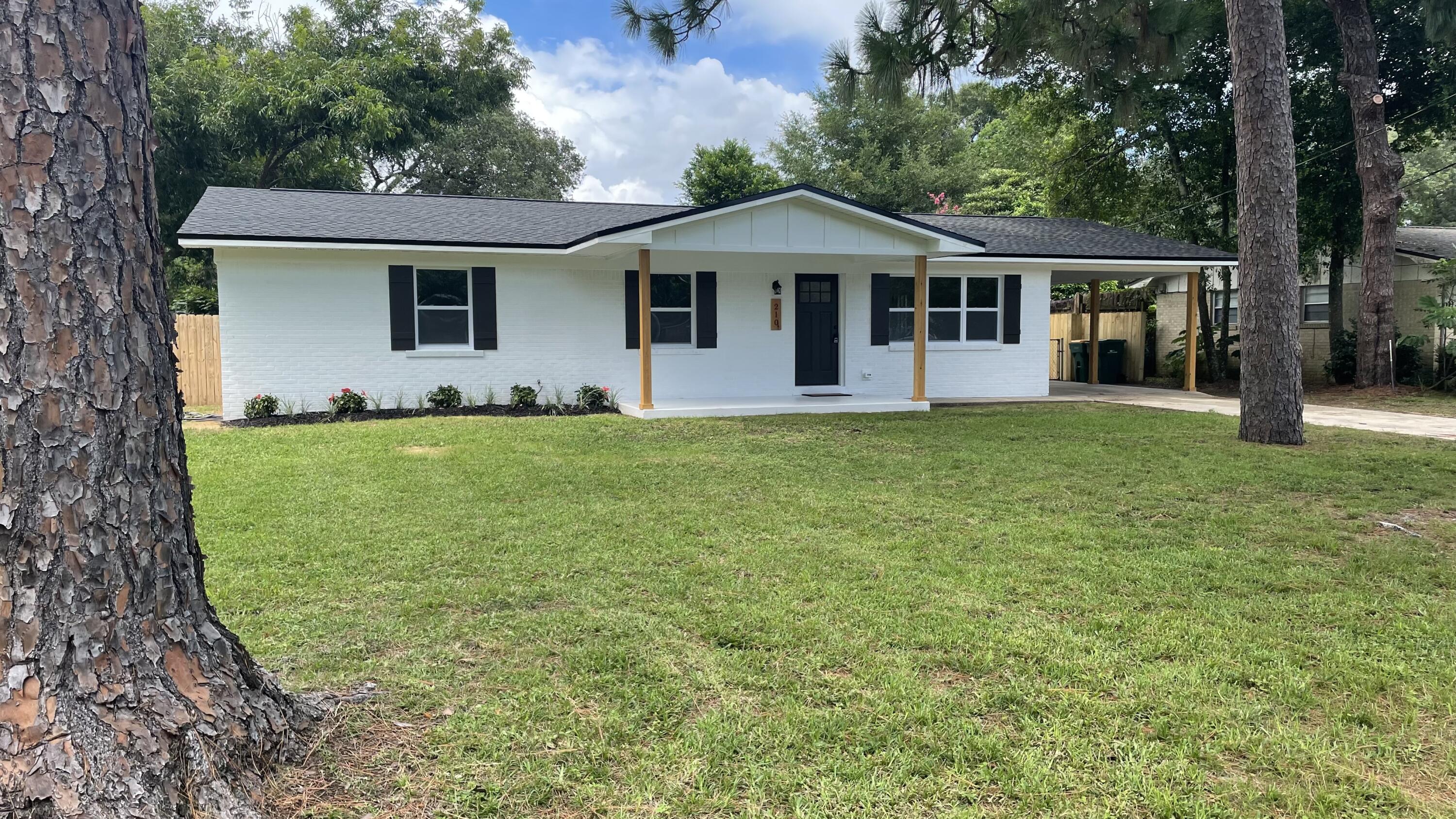 This beautiful freshly renovated home within Colonial Estates is ready to be your families dream home. As you step into the home you're greeted with an open floor plan with an entirely brand new kitchen including a lovely island that makes a great breakfast bar. As you walk through the spacious living room amazing new floors guide you to the back of the house. No stone being left unturned, both bathrooms feature a luxurious update with the master featuring fully tiled in walls. The bedrooms themselves having been updated with carpet to keep that cozy feeling. As you make your way to the big backyard perfect for your favorite pets you'll notice the laundry room eloquently off to the side with its own back door. With this home having all the bells and whistles it certainly won't last long.