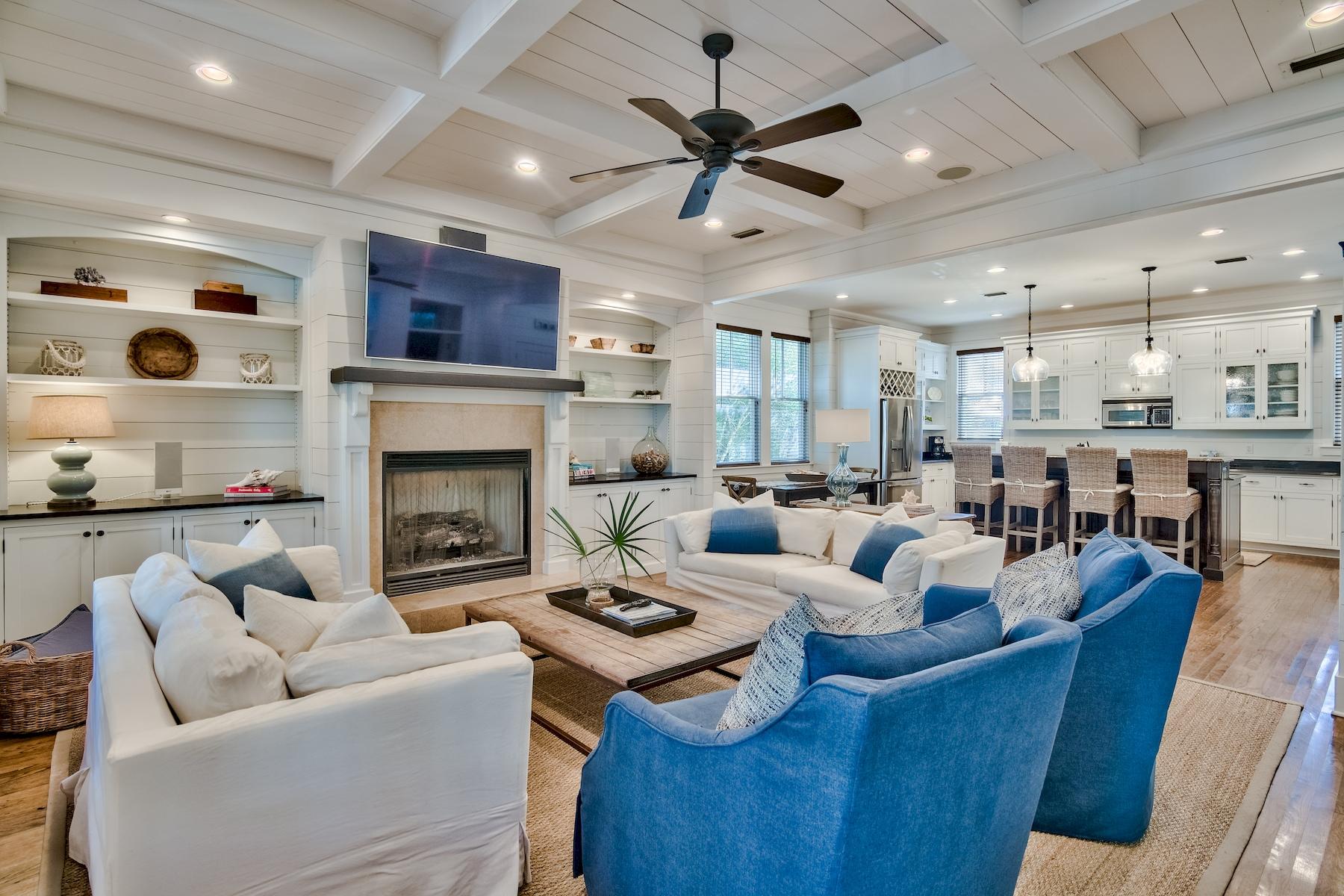 Property currently under contract with a kick out clause. Tucked in Phase I of WaterColor, this inviting coastal retreat offers elegant finishes and close proximity to Western Lake and infamous Emerald Coast beaches. The home features an open floor plan with beautiful hardwood flooring and shiplap accents on the walls and ceiling. A perfect place to gather with family and friends, the living room features a fireplace, and the home also offers a surround sound system. A gourmet kitchen provides ample storage, granite countertops, and a breakfast bar.  Two additional dining areas are located inside while three sets of French doors lead out to an expansive screened porch with plenty of room for outdoor dining and entertaining.  A guest suite and a laundry room are located on the first floor, while the second floor features three additional bedrooms and another large screened porch.  A spacious owner's suite includes its own laundry room, as well as a luxurious bathroom with a double vanity, oversized tub, and a walk-in shower. 

This home offers several private amenities, including covered parking, an outdoor shower, multiple owner lockout storage spaces, and an outdoor grilling area. Its ideal WaterColor location provides easy access to white-sand beaches, and residents can enjoy exquisite community amenities, including tennis courts, pickleball courts, Camp WaterColor, and the newly-designed WaterColor Beach Club