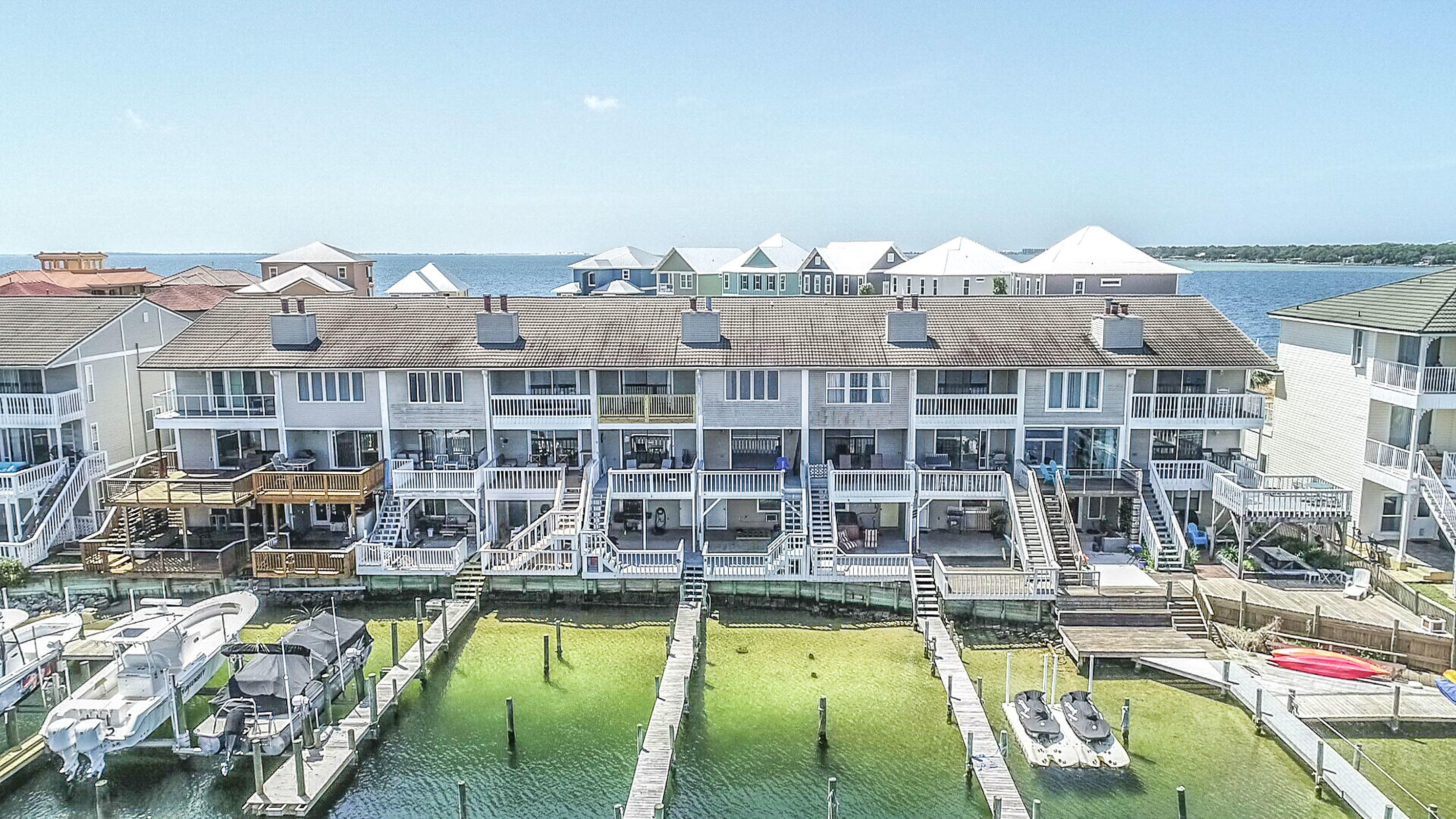 Waterfront town home with attached deep water boat slip, suitable for power or sail boat. Great condition and recently renovated. Extensive decks on the back side of this unit have great views of the Choctawhatchee Bay. You will enjoy your morning coffee on the water, the beautiful sunsets and more dolphins than you can imagine. The second level is the main living area with large family room, kitchen and half bath. Laundry room with washer and dryer is also located on this floor. Two large bedrooms are on the third level, each having it's own full bath. Two car garage under this unit allows extra space for storage of cars and water toys. Located close to Eglin AFB, Hurlburt AFB and Destin-FWB (VPS) Airport. Contact owners. Alicia at 9079879474 and Liz at 80433829