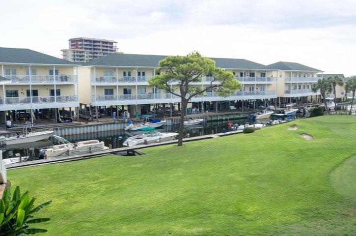 This lovely condo looks out to the canal and overlooks the 8th fairway of the on site golf course. Just across the street is the beach, enjoy the refreshing pools or the 6 tennis courts. Fabulous restaurant on-site (Louisiana Lagniappe) that gives you a great view of the lagoon and marina.  Close to many top attractions. Collect rent when you are not enjoying this wonderful condo yourself. What a value! Buyer to verify all information.