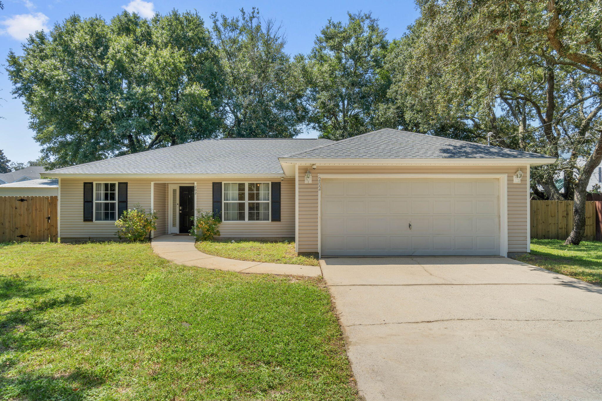 Welcome home to this move in ready 4 bedroom, 2 bath recently renovated home in the heart of Fort Walton Beach. Conveniently nestled near shopping, restaurants, and between Hurlburt Field and Eglin AFB you're going love this location here on the Emerald Coast! Have peace of mind with a 2022 roof, 2020 water heater, 2020 HVAC system, 2022 kitchen appliances, as well as a whole home Generac generator. Enter inside and you'll love the soaring tall ceilings, large windows, and the luxury vinyl plank flooring that extends all throughout the house. Renovated in 2022 enjoy a kitchen with all new white cabinetry and granite countertops open to the eat in kitchen area and spacious living room. The owner's suite is a fantastic space with a trey ceiling, large walk in closet, and ensuite with a huge walk-in corner shower. The other three bedrooms are nice sized with ample closet space and another full bathroom with an updated vanity. The fenced in backyard features a large storage building and shaded back patio space to enjoy.