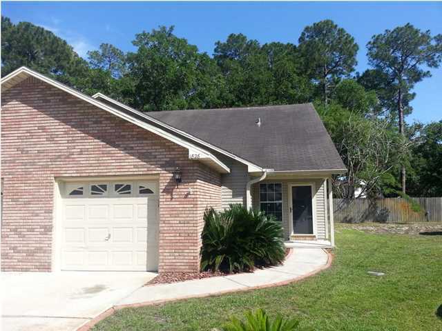 Immaculate end unit townhome with 3 bedrooms and a 1 car garage. This home is beautiful. The townhome has wood floors downstairs and newer carpet upstairs. Back patio for entertaining includes built in gas grill. Pet is possible with approval - restrictions apply. Easy care yard. Association takes care of most of the yard.