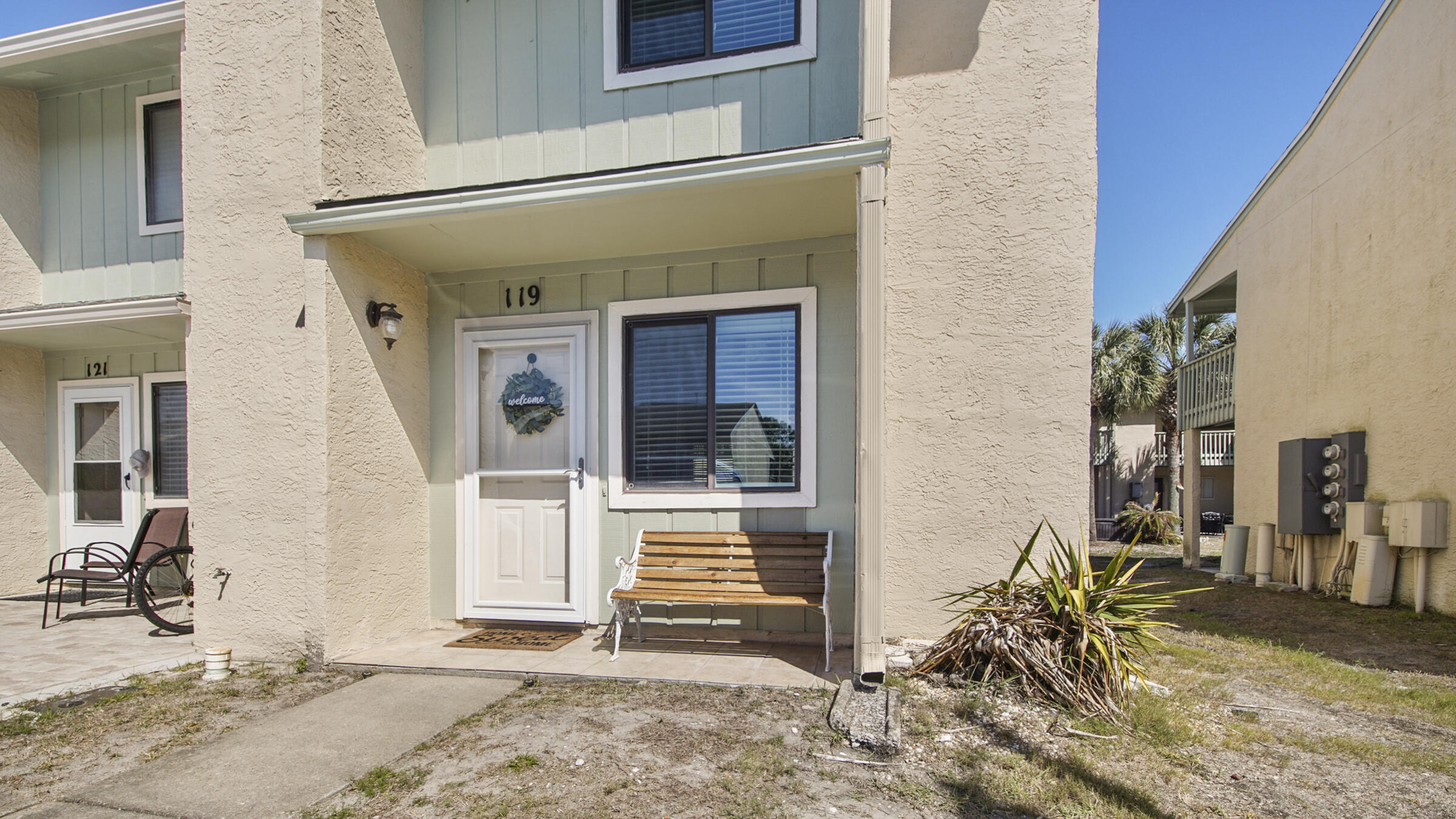 Great opportunity to own a this nice, fully furnished end unit townhome that allows short term rentals & comes with a golf cart! This one is rental ready or live in it full time! Downstairs boasts a spacious updated kitchen w/granite counter tops, dining room, living room & a half bathroom for guests. Upstairs features two large bedrooms each with their own full bathroom! Enjoy sitting on the covered back patio or swimming in one of the 11 swimming pools (5 heated)! The community also offers a 2 acre putt-putt golf course, shuffle board courts, 4 tennis courts & a club house w/pool directly on the beach. Life can't get better than this!