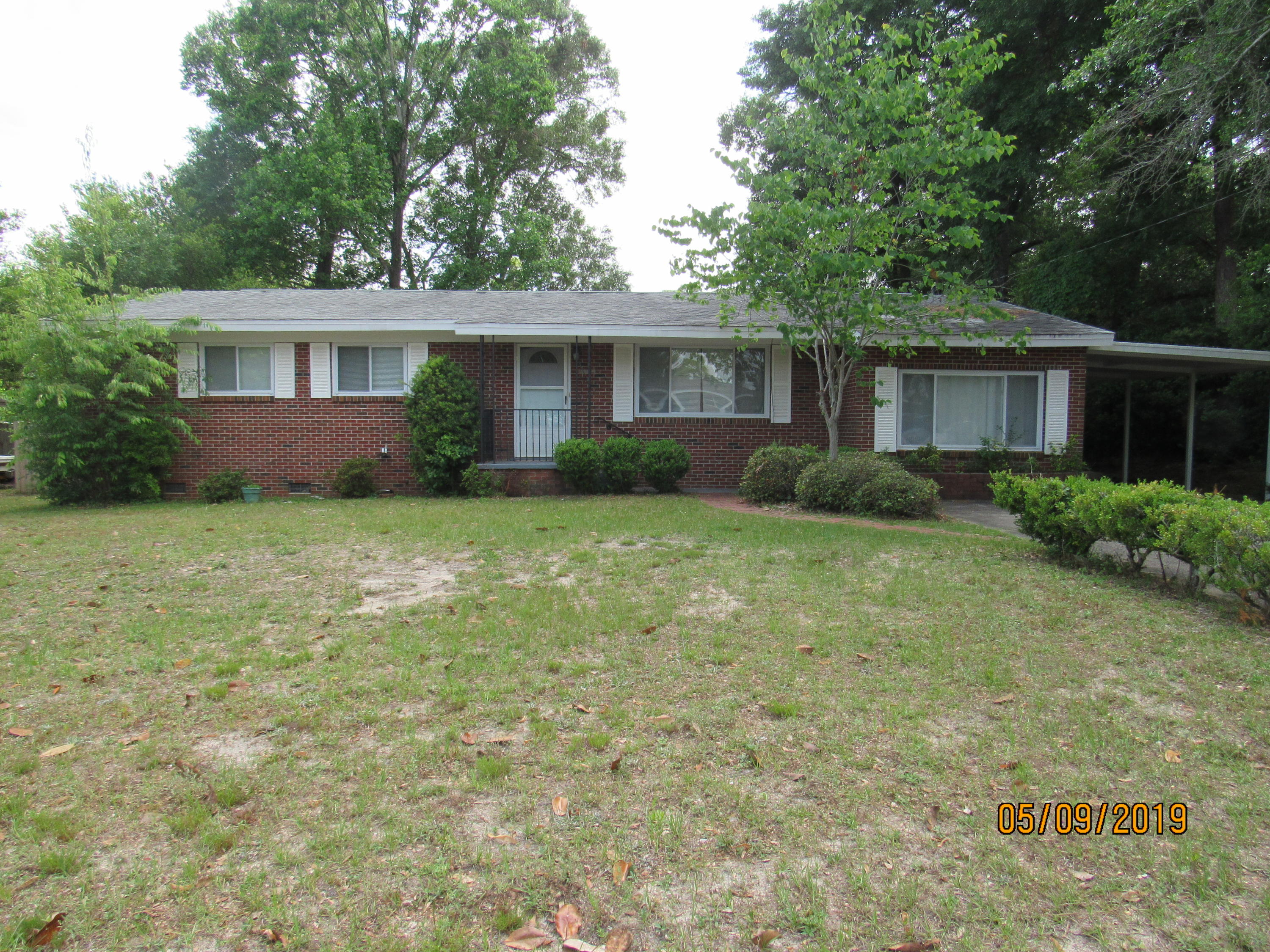 Adorable 3 bedroom, 2 bath brick ranch house with plenty of upgrades! This home features hardwood and tile flooring throughout, neutral paint, and plenty of space! The kitchen has been upgraded with granite counter tops, stainless appliances, and flat cooktop stove. From the dining room, double doors lead out to a covered back deck overlooking the large back yard. A sunken den could be utilized as additional living, dining, office, or flex space. The laundry room is huge and connects to an unfinished fourth bedroom (currently utilized as storage). The master bedroom has an en suite with double vanities and a tiled shower, and the two guest bedrooms share a full guest bath. Pets may be considered on a case by case basis. No smoking.