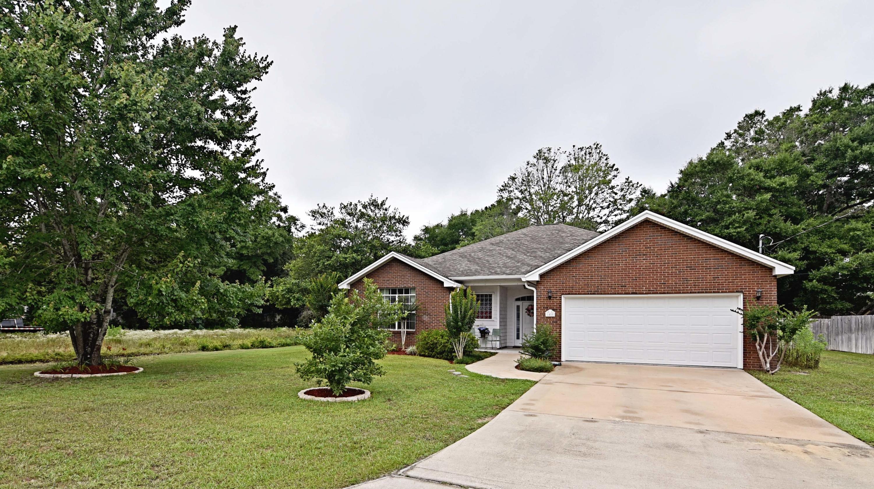 This lovely 3 bedroom, 2 bath home is move in ready! Built in 2005, the home is situated on just over a 1/3 of an acre and has a large fenced back yard and paver patio, which leaves plenty of room for you to add a pool! The living spaces are all roomy and bright and open, with 18'' tile in the living room, dining area, baths, hall and laundry and wall to wall carpet in the bedrooms and coffered/tray or raised ceilings in some rooms. Custom features include bull nose corner walls, and arched entries as well as custom made Clear View corrugated polycarbonate hurricane shutters. Beautiful wood kitchen cabinets, stainless steel appliances and loads of counter space make the kitchen a cooks delight! Zoned for Bluewater Bay Elementary, this is the home you have been looking for. Across from the park and playground, this is a perfect family home! Complete with an alarm system, it has everything you need. Don't hesitate to see it today!