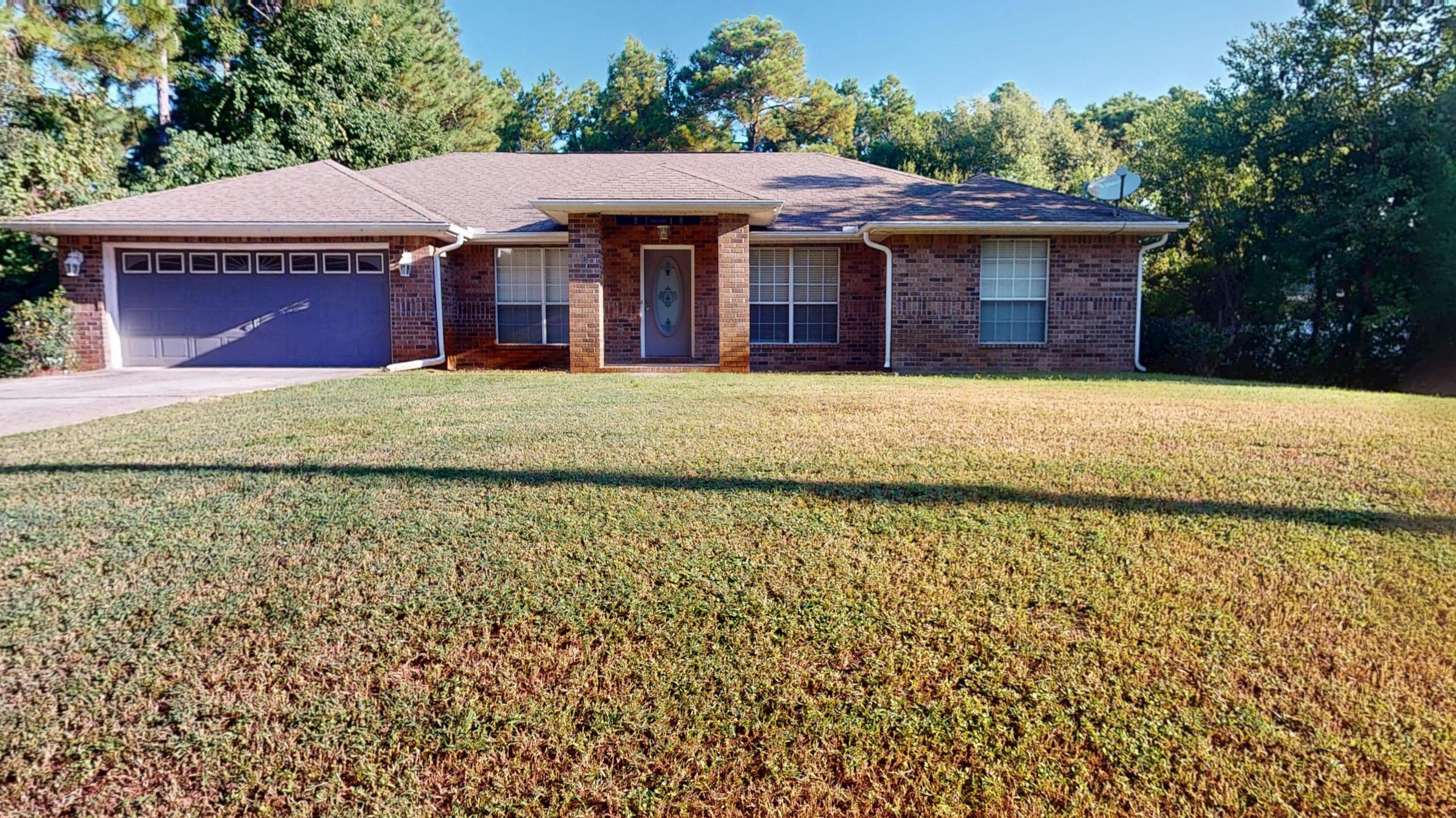 Come see your next home or investment property in Navarre that is a four bedroom and two full baths with new paint throughout and also includes a fireplace and vaulted ceilings.  There is all new flooring throughout the home and the AC has been recently replaced.  The kitchen is a wonderful place for cooking and has numerous cabinetry for all your dining needs.  The kitchen has a breakfast bar that opens up to a wonderful breakfast nook and the home also has a dining room.  The Main Bedroom has a large  walk in closet with an amazing master bath that includes double vanities, a large garden tub and separate shower.  There is a large back yard that has plenty of room to add a pool  and a small patio that is accessible from the Main Bedroom and the Great Room.