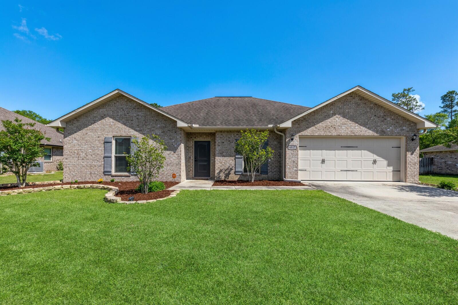 SOUTH OF CRESTVIEW!  Open house Sat 30 10-1, Sun 31 11-2 Beautiful all brick 4 bedroom/3 bath home with a short distance Duke Field & Eglin AFB. Spacious living room with 9-foot ceilings. Gourmet GORGEOUS kitchen with granite countertops, stainless steel appliances, CUSTOM free-standing Island (SEE PICTURES), pantry, tiled floors, tiled backsplash, double stainless-steel sink, nickel cabinet pull bar handles, nickel pull out faucet with plenty of cabinet & countertop space. Corner dining area has large windows for viewing backyard. All wet area is tiled. (See photo).  Double doors leading to the spacious master bedroom. master bathroom has granite countertops, nickel hardware, separate shower & garden tub. The fourth bedroom has a full bathroom. Click here for comments.. Stainless steel appliances include stove, microwave, dishwasher and refrigerator. Washer and dryer may convey if needed. Great utility room with sink and cabinet. Fourth bedroom has connecting bathroom to utility room. Great Flat backyard with privacy fence and sprinkler system. Large garage with shelves and pull downstairs. There is a water shut off panel box in garage that allows you to shut water individually in certain rooms. Home has gutters too! Subdivision has underground utilities, decorative lighted light poles and mailboxes.  Flood insurance is $596 annually. TV mount does not convey. Vivant security system equipment will be paid for at closing. There is a monthly service charge to keep activated though.