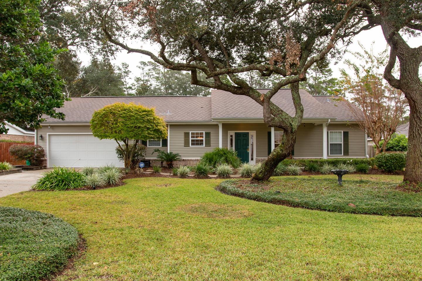 AVAILABLE JANUARY 2,2019
Wow! That is the first reaction when you pull up to this 3 bedroom 2.5 bath home with its beautiful manicured landscape! As you approach the home you will notice even the driveway and sidewalk have been specially designed to appeal along with the cozy front porch. When you enter the home your eyes are drawn to very open living room/dining/kitchen area complete with easy care tile flooring and a precious freestanding fireplace (for decoration purposes only). The kitchen features stainless appliances including a gas stove/double oven and pantry. From the living room there is a large Florida room that currently serves as an office but offers great views of the backyard and the lovely pool! The Florida room originally ran the length of the back the home from the living area to the Master bedroom but has been split so 3/4 of it is the office and the other side by the Master bedroom is now a small room that is perfect for a TV, exercise, or reading room.  To the left of the home is the laundry area, a powder room, and master bedroom.  The spacious master bedroom and bath have lovely wood plank tile flooring.  On the other side of the home are the remaining 2 bedrooms and guest bath.  As you exit the Florida room you enter an inviting screen porch complete with TV (conveys As-Is) and is perfect to relax anytime of the year with fabulous views of the sparkling pool and lush backyard.  Off to the left of the screen porch is a large open wooden deck area offering loads of room for seating/entertaining along with a darling covered area perfect for grilling in inclement weather.  Home offers one storage building that is convenient for keeping all lawn equipment.  There is an additional large storage building that is separated by a small gate that has power and is awesome for additional storage or a workshop...not to mention the additional parking that can be accessed from the extended gravel driveway from the front to beyond the backyard gate!  Call today as this will not last long!