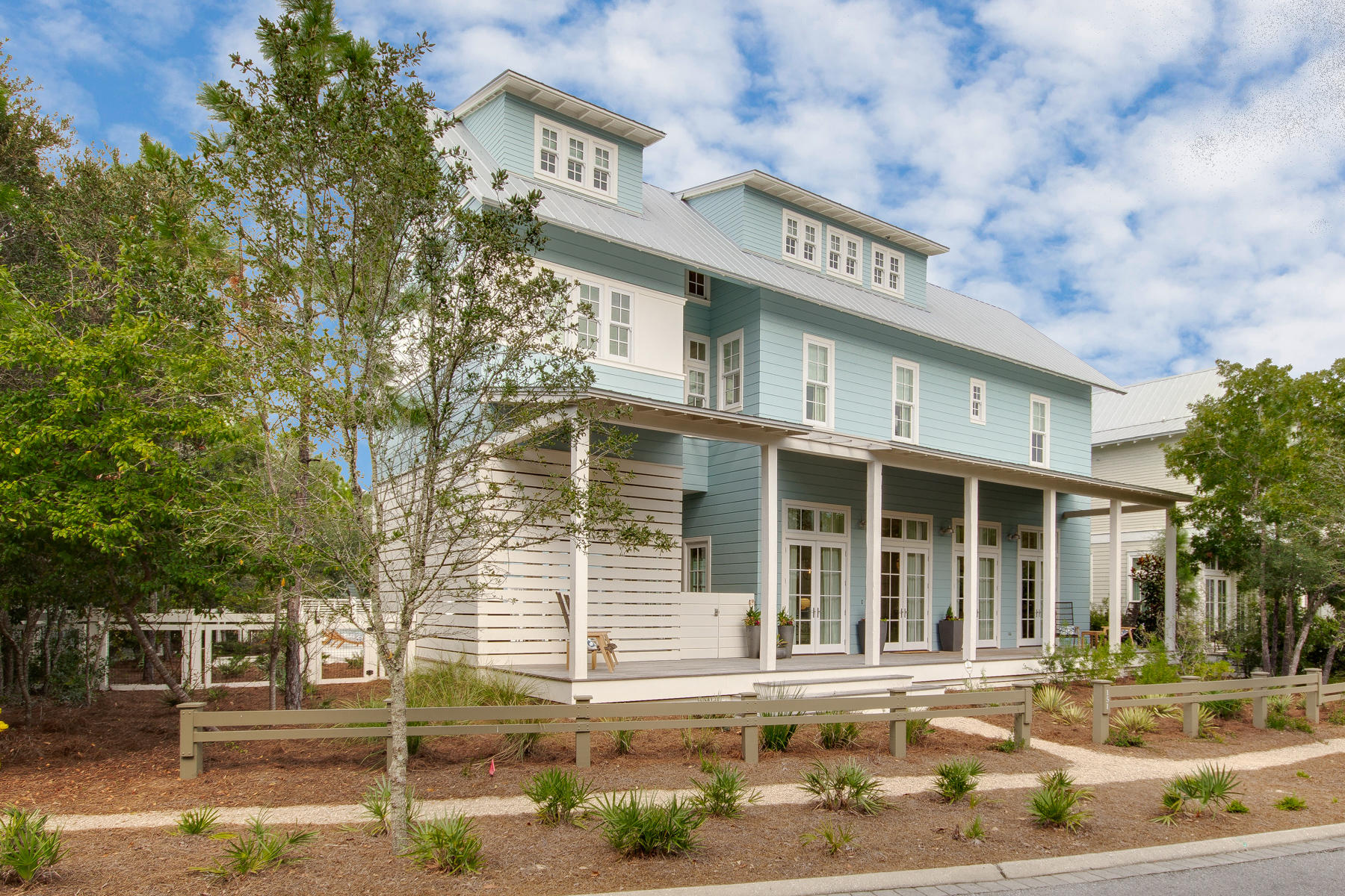 Unwind in your private pool and spa after a long day at the beach, grill out and entertain in your large outdoor living area, or host your guests in your custom built, fully equipped kitchen. A spacious, open floor plan with twelve foot ceilings, white shiplap walls, oak wood flooring and Quartz countertops complete this classic coastal retreat. This home has plenty of room for entertaining family and guests with a stunning great room with a dining area perfectly made for a holiday feast and living space to enjoy the big game or favorite movie. The gourmet kitchen and great room adorn floor to ceiling doors and windows which offer picturesque views of the summer kitchen and pool. Don't forget the s'mores by the fire pit. 5 bedrooms, and a secondary living area on the third floor, including an additional sleeping area, are ideal for teens and toddlers.   On the second floor you will find a luxurious master suite with a private porch, reading area, a stunning master bath complete with lavish fixtures and finishes like a large soaking tub, marble tile and dual vanities.   
Located in the new urbanism community of WaterColor, residents will have the chance to enjoy amenities like parks, walking trails, an outdoor amphitheater for entertainment, access to paddle boards, kayaks, multiple community pools and a state-of-the-art workout facility.   The sugary sand of the Gulf of Mexico and the Beach Club are a bike ride away.  Your new home awaits you.