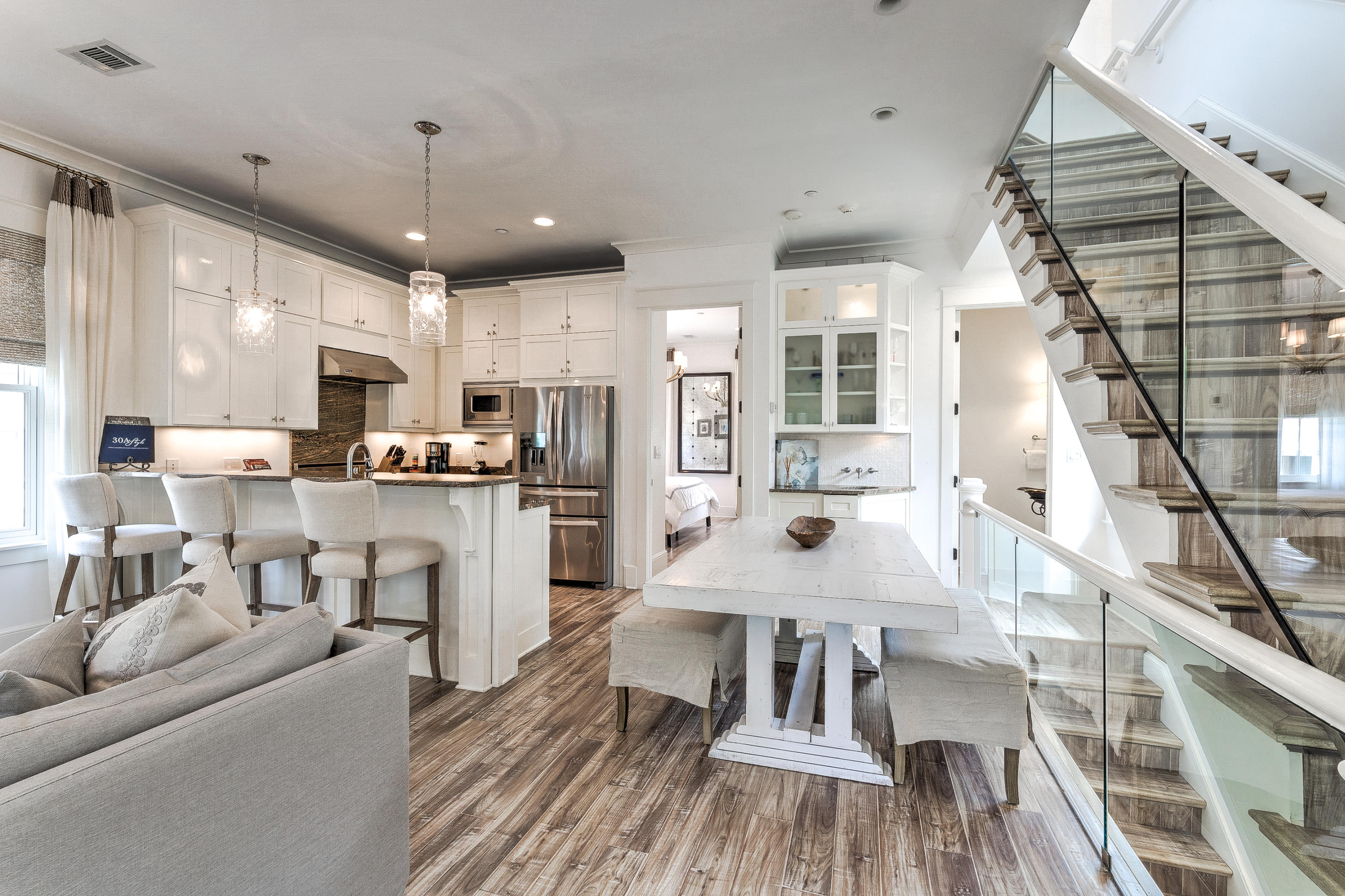 *SELLER IS ACCEPTING BACK-UP OFFERS.*Spectacular Rosemary Beach home with carriage house. This beautiful 3-story home was designed with all the style and charm of Rosemary Beach in mind.
It's light, bright and decorated with coastal flair. As you enter the gate you will be greeted by a spacious, enclosed courtyard with plenty of seating for guests to enjoy their morning coffee or evening cocktail.
The first floor of this home has a comfortable den with seating for 4 and a flat screen TV, a fabulous hangout for the kids.
Off this den you have a bunk room with 2 full beds, sleeping 4, a flat screen TV and an attached bathroom with a large walk-in shower.
Continue down the hall and you will find the first king bedroom with attached bathroom. This bedroom is decorated in neutrals to help accent the natural beauty of the surroundings as you look out the windows.  The bathroom attached to this bedroom has a vanity with granite countertops and a tiled tub/shower combination.  

Head up the stairs to the second floor and you will find a powder room off the kitchen as well as a wet bar and ice maker. 

The kitchen has beautiful, dark granite countertops that contrast magnificently with the natural light filling this main living space.  

The kitchen has high-end appliances to make whipping up any meal a breeze. 

There's also a large bar top off the kitchen with seating for 3 and a seating area with 2 chairs that's perfect to sit, relax and keep the chef company while they're cooking.

Continuing with this wonderful open-concept space you will find the living room with a large, flat screen TV and plenty of seating, as well as a dining space with seating for 4. 

There's also a master suite located on the 2nd floor. The master bedroom boasts a king bed and a private bathroom. 

Another wonderful feature of this 2nd floor is the large covered balcony with 2 large porch swings.  This is the absolute perfect spot to relax with a book, simply enjoy the salt air, or take an afternoon nap after a day at the beach.  

Take the stairs up to the 3rd floor and you will find another lounging space with flat screen TV, chaise lounge and fun bean bag! This floor also has 2 queen bedrooms and a shared full bathroom with double vanity and tub/shower combination.  

Continuing on to carriage house, you'll find it beautifully appointed and with a large open living space complete with a comfy sectional couch and flat screen TV. 

There's also a dinging space with seating for 4 plus a well-equipped kitchen. 

Carriage house has a queen bedroom with an attached bathroom, including a granite vanity and tub/shower combination. 

Take the spiral staircase up and you will find a sleeping loft with a king bed and day bed with trundle. 

There is also a second bathroom off this space with a granite vanity and glass walk-in shower.  

Short walk to the pool and private Rosemary beaches, tennis courts, workout facilities, and restaurants and shopping.

This property would make an exceptional rental investment or 2nd home. Contact us today to see it in person.