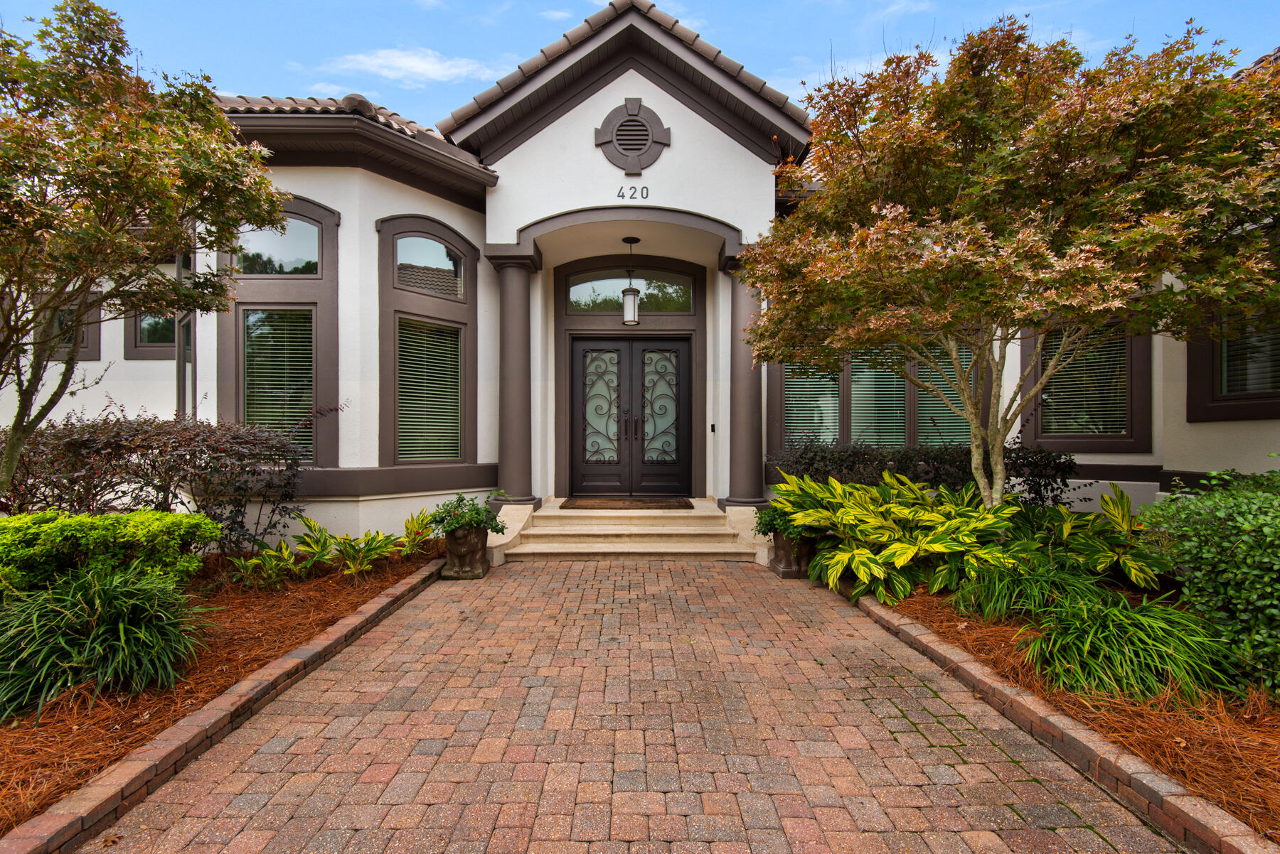 The PERFECT floor plan awaits in this gorgeous perfectly executed three-bedroom plus office home in Regatta Bay on the second fairway. The list of updates is impressive: they include a new 2023 roof, an updated interior kitchen, renovated pool bath with outdoor full kitchen & grilling area, exterior and interior paint, new hardwood floors, and a spectacular wine wall, to name a few. The flow of this home is beautifully designed, which features two living areas, an amazing outside living area, and a covered pool, all on one level. With multiple patio access points it's perfect for entertaining. The primary suite is tucked away and private from the main living space. The residence's architectural appeal includes coastal flair and elegance, giving its owner a magnificent lakefront property with 100 feet on the lake in the exclusive gated enclave of Regatta Bay.

You will enjoy sitting on your very own private deck feeding the turtles, dipping into your private heated pool, and cooking and enjoying your full outdoor kitchen with bar and tv. Your spacious garage includes a golf cart parking space to jump right into enjoying the lifestyle of Regatta Bay. A stairwell-access attic for additional storage is conveniently accessed with a full stairway.

Regatta Bay is Destin luxury living at it's finest. Amenities include a 6,894-yard, par-72 course named one of Golf Digest's "Top Places to Play in North America", a clubhouse offering first-class dining, tennis courts, community large lap pool, playground, and walking paths. You will enjoy the additional private gated entrance on the North side of the community offering easy access by golf cart or car to the boating club at Legendary Marine and Yacht Club! The Destin Commons Shopping Center as well as Whole Foods are easily accessible by golf cart without ever having to get on Highway 98. The beach on Scenic Hwy 98 is just a mile away and is also accessible by golf cart!

The community is ideally situated on the eastern end of Destin within easy reach of excellent rated schools, shopping, dining, entertainment and Caribbean-like beaches and the crystal clear waters of the Gulf of Mexico.