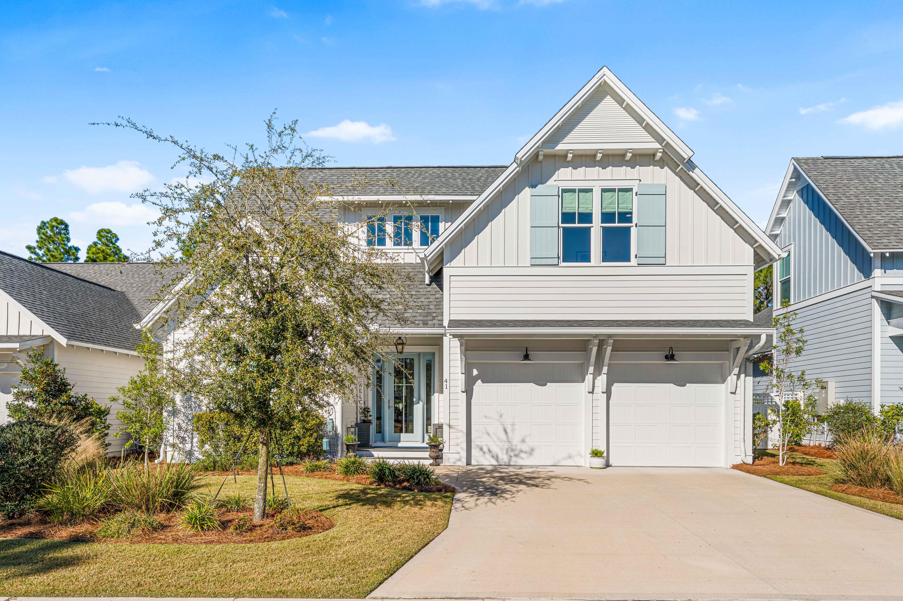 Welcome to this spectacular home in the Pines section of WaterSound Origins, where every detail is designed for privacy, comfort, and effortless entertaining. Set on a quiet, low-traffic street, this elegant retreat features a spacious backyard bordering serene woods and professionally landscaped grounds with a privacy fence. Step inside to a stunning open-concept living room, dining area, and kitchen, all filled with natural light, soaring 10-foot ceilings, and expansive windows offering beautiful views of the backyard and sparkling custom saltwater pool complete with a sunshelf and spa, all surrounded by a shellstone deck and Mexican pebble edging. The oversized screened porch extends your living space outdoors, perfect for al fresco dining, relaxing, or soaking up the Florida sunshine The main level boasts a first-floor primary suite with a spa-inspired bathroom, while the large kitchen includes a giant walk-in pantry and an oversized island ideal for gatherings. Upstairs, a versatile nook and a second suite provide extra space for family or guests. This exceptional layout blends indoor and outdoor living for the ultimate coastal lifestyle.

Upgrades abound, starting with a beautiful front door with sidelights and a charming gas lantern welcoming you on the front porch. Three additional bedrooms, two full bathrooms, and a convenient powder room on the main level provide ample comfort and flexibility for family or visitors.

Additional thoughtful upgrades include a tankless water heater, stainless steel vent hood, a 36" Bosch gas stove, Bosch refrigerator, Bosch dishwasher, Sharp microwave drawer, and elegant quartz countertops. The home also features crown molding, custom trimmed openings, and detailed window casements throughout. Other upgrades include a Culligan reverse osmosis undersink water filtration system, gutters installed around the home, and premium landscaping for a truly elevated living experience.

Located just minutes from pristine beaches, shopping, and dining, this home combines comfort and convenience in one of the area's most sought-after neighborhoods.

Ideally located near the vibrant communities of 30A, Rosemary Beach, and Alys Beach, this home places you just moments from world-class dining, boutique shopping, and beautiful white-sand beaches. For those seeking even more, optional membership in the exclusive WaterSound Clubs unlocks access to additional amenities, including a private beach club, golf courses, pools, and fine dining, allowing you to fully embrace the best of coastal living. 

As a resident of WaterSound Origins, you'll enjoy access to an array of premier community amenities, including a resort-style pool, fitness center, par 3 golf course, tennis and pickleball courts, miles of nature trails, parks, playgrounds, and access to Lake Powell for kayaking and paddleboarding.

Don't miss the opportunity to make this exceptional WaterSound Origins retreat your own. Schedule your private showing today and discover the perfect blend of luxury, privacy, and coastal living!