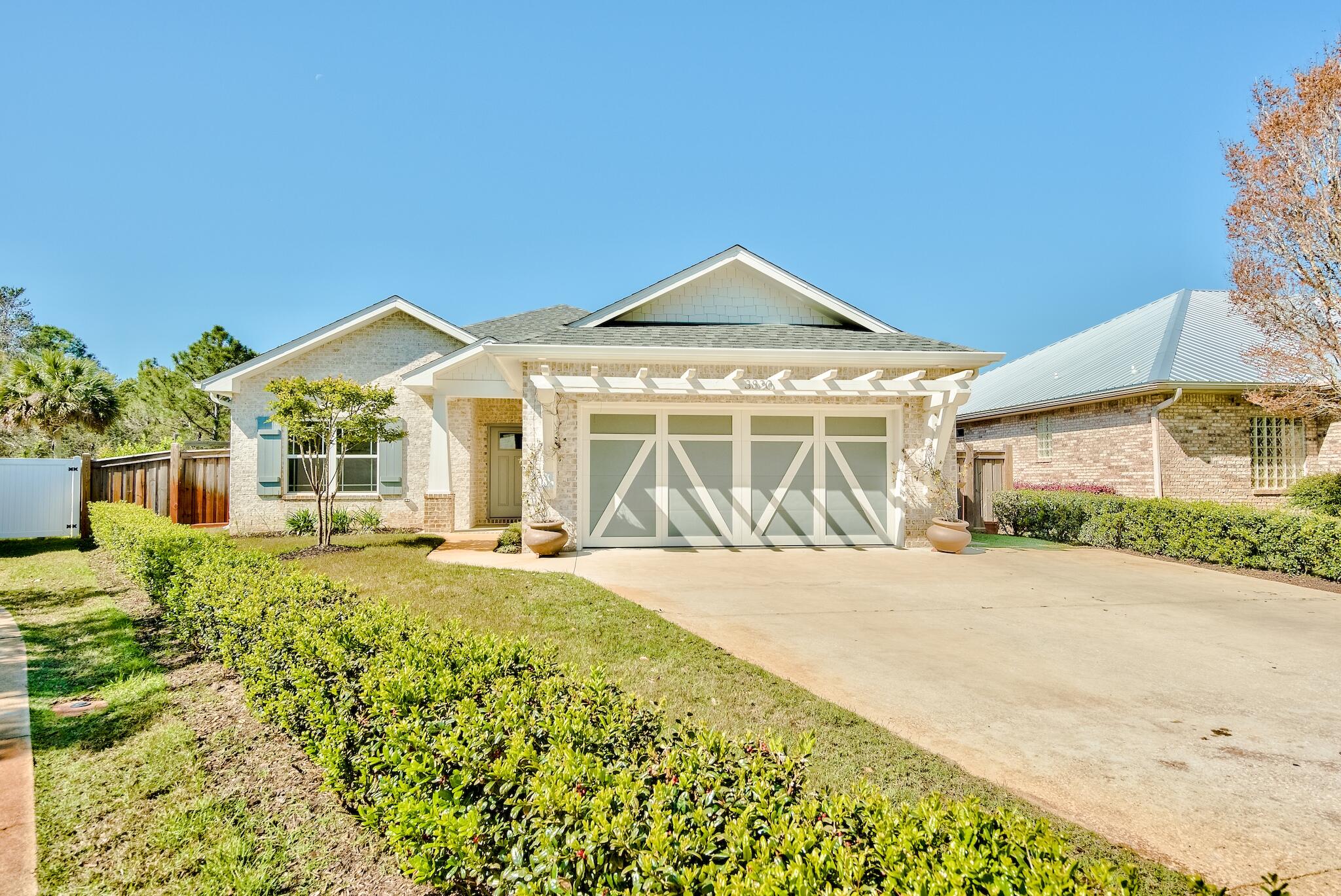 Absolutely gorgeous, 2017 custom built home in the heart of Destin. Built by quality local builder RAK Construction, this exquisite home offers many features and upgrades throughout! Upon entering the house you will immediately notice the custom wood beams and fixture in the foyer. Attractive tile floors are throughout the living area, kitchen, dining and baths, with soft carpeting in the bedrooms. The living room offers built-in book cases and flows right into the kitchen and dining space. Kitchen features include quartz counters, walk-in pantry, and stainless steel appliances. Features of the master suite include a brick accent wall, custom tray ceilings, large shower with rainhead faucet, and unique subway tile backsplash that runs the entire wall. Other features and upgrades of this  home include shiplap accent walls, soft close cabinetry, custom built-ins in all closets and the pantry, Satin nickel plumbing fixtures, LED recessed lighting, fiberglass exterior doors, Craftsman style crown molding, barn doors at the laundry room, sound proofing in all interior walls, Pergola over the carriage style garage door, large screened-in back porch, fully fenced-in back yard, concrete grill pad, fruit trees, as well as a swing set, sandbox, and climbing wall for children! This incredible home will not last long, come take a look! Buyer to please verify all information contained herein.
