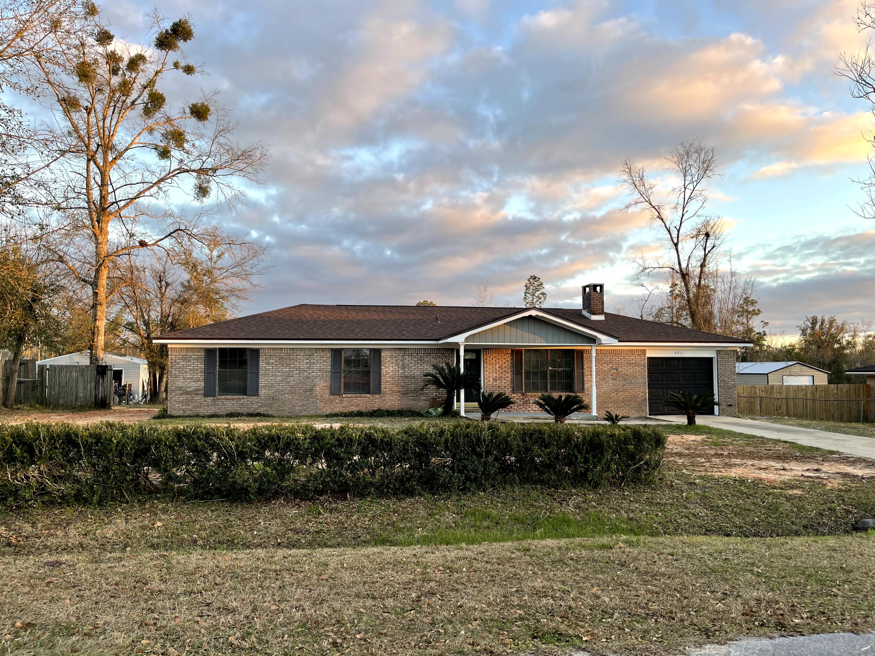 BUYERS FINANCING FELL THROUGH Looking for a desirable neighborhood with easy access to Panama City Beach, Freeport and Santa Rosa.
This completely renovated home is ready to welcome new owners! This 4-bedroom, 2- bathroom home has an open-floor concept with a fireplace. The kitchen has been completely updated with modern cabinets, beautiful countertops, and stainless-steel appliances. Brand new carpet in all 4 BD, and tile floors in living room, baths, kitchen and dining area. The interior has been freshly painted with neutral colors. Seller has not missed a detail. As you view the home, don't miss the new fixtures, vanities, and celling fan. New HVAC installed in 2020, well pump replaced in Nov 2019. The back yard is perfect for children or pets. This home won't last long. Call for your