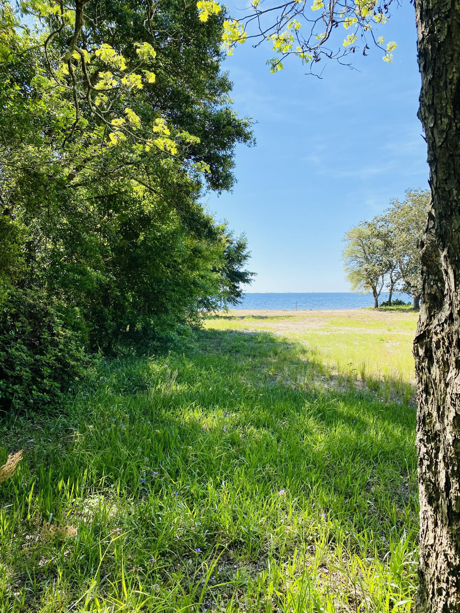 LOCATION, LOCATION, LOCATION. VERY RARE FIND. This deep waterfront lot is perfect for large boat owners and a fisherman's dream. Are you ready to enjoy the sunrise overlooking Choctawhatchee Bay? It has the most beautiful, expansive, and unobstructed view of Destin. Escape to paradise every day watching the dolphins play. Very few deep waterfront lots available with this vast view in a convenient location. It's centrally placed  between Eglin Air Force Base and Hurlburt Field.  Also, just under 3 miles to FWB Medical Center, schools, shopping, and wonderful local restaurants. Enjoy the area's community fireworks from Niceville to Destin to FWB from your backyard. This well established neighborhood boasts a divided road with mature oak trees and  Garnier's Beach Neighborhood Park. It doesn't get any better than this. If you're wanting to build, look no further, you've found the right property. The lot is cleared and leveled with a seawall in place. The seller owns a local construction company specializing in design build and has built a few of the homes in the subdivision. Hire the seller as your builder or bring your own builder and plans. The freedom of choice is yours. Survey is available and included in the listing documents.
Buyer to verify all dimensions and information.