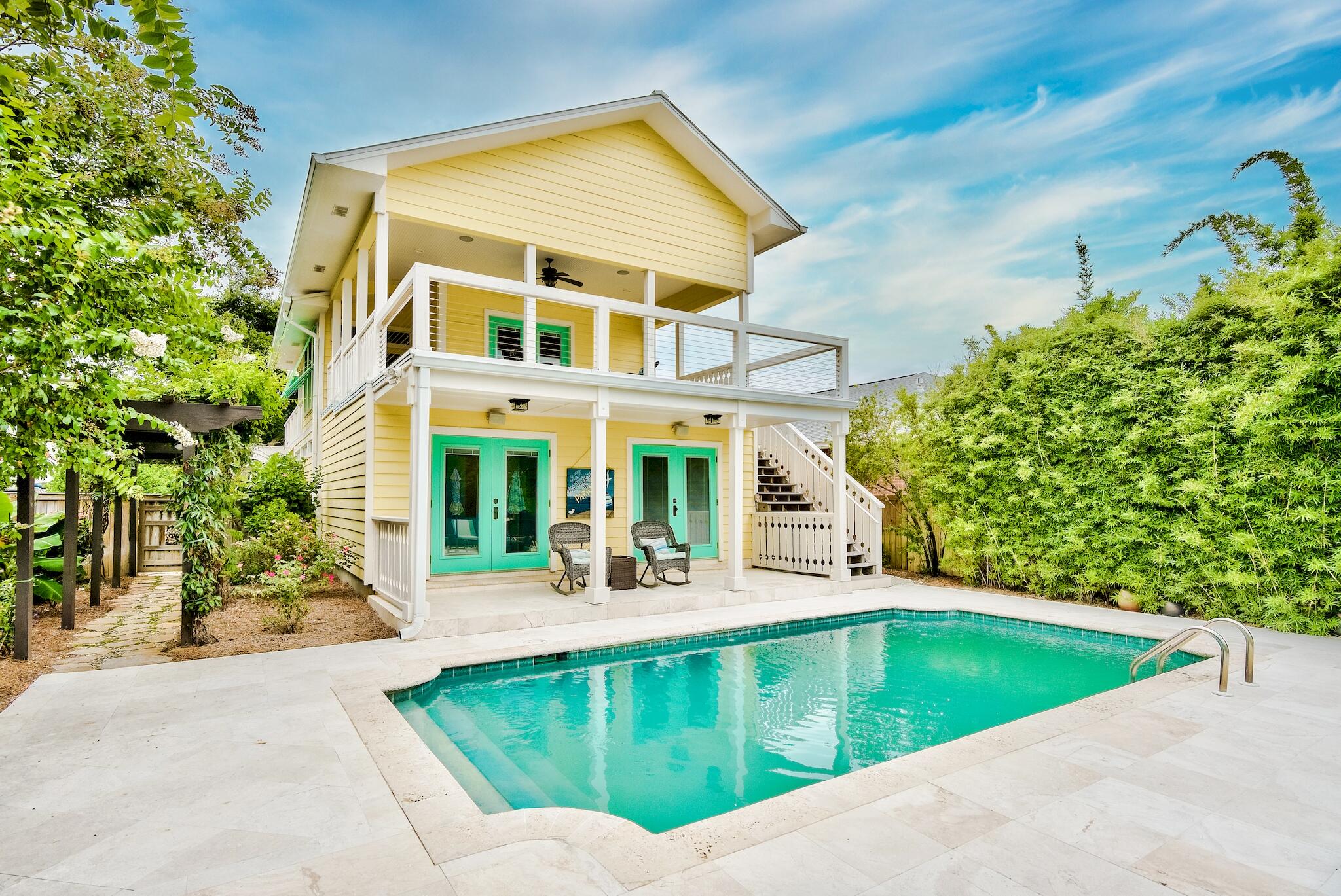 Half a block from the sugar white sands and emerald waters of Crystal Beach, this elegant coastal five bedroom, three and a half bath residence is tastefully updated, landscaped, and poised to become a new primary or secondary home, or exceptional vacation rental. Desirable features include the extra-deep lot with a one car garage, private pool, outdoor bar pagoda, lush side courtyard with a soothing fountain, Italian limestone, and high-end finishes, setting this home apart from anything comparable. Hand-milled walnut flooring accentuates the fabulous open living area and commercial-grade luxury kitchen with durable granite countertops, two Sub-Zero refrigerators, large Wolf gas range and a wine fridge. Enjoy drinks on the expansive breezy second story deck off of the living area. Fine custom cabinets, lofty vaulted ceilings, and solid wood doors throughout the house. The master suite is a true escape, complete with his and hers closets, a soaking tub and separate shower, and gulf views from the private third floor master balcony. Rinse off the sand after a day at the beach with the outdoor shower. Enjoy plenty of indoor and outdoor space for guests while tucked back just steps from the beaches, shops, and restaurants of scenic 98 and all Destin has to offer.