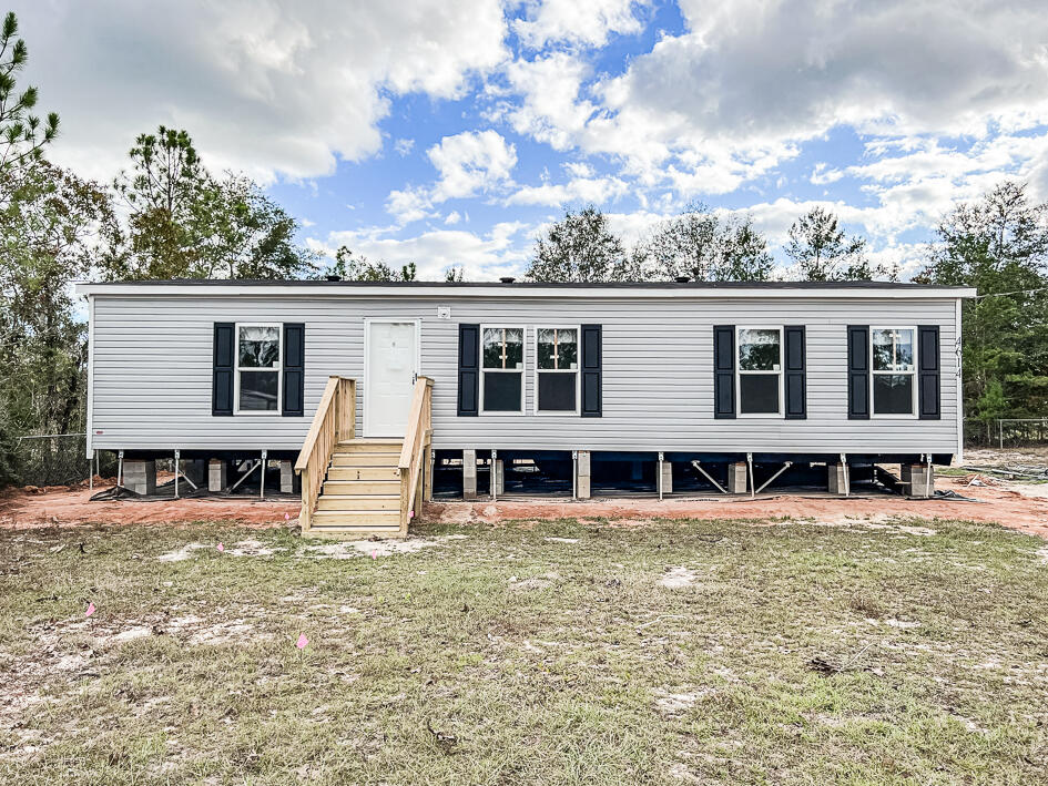 Available 01/01/2023.  Country living with no HOA restrictions make this 3/2 new home a gem.  Easy commute to bases, beaches and shopping.  Minutes to SR 285.  Spacious kitchen with island and faux brick accents.  Neutral paint and plenty of natural lighting throughout.  Spacious rooms and bathrooms.  No inside smoking.  No inside vaping.  Partially fenced yard.  Yard building for storage use.  Pets may be allowed with a $400 non-refundable pet fee and owner approval. Large level lot.