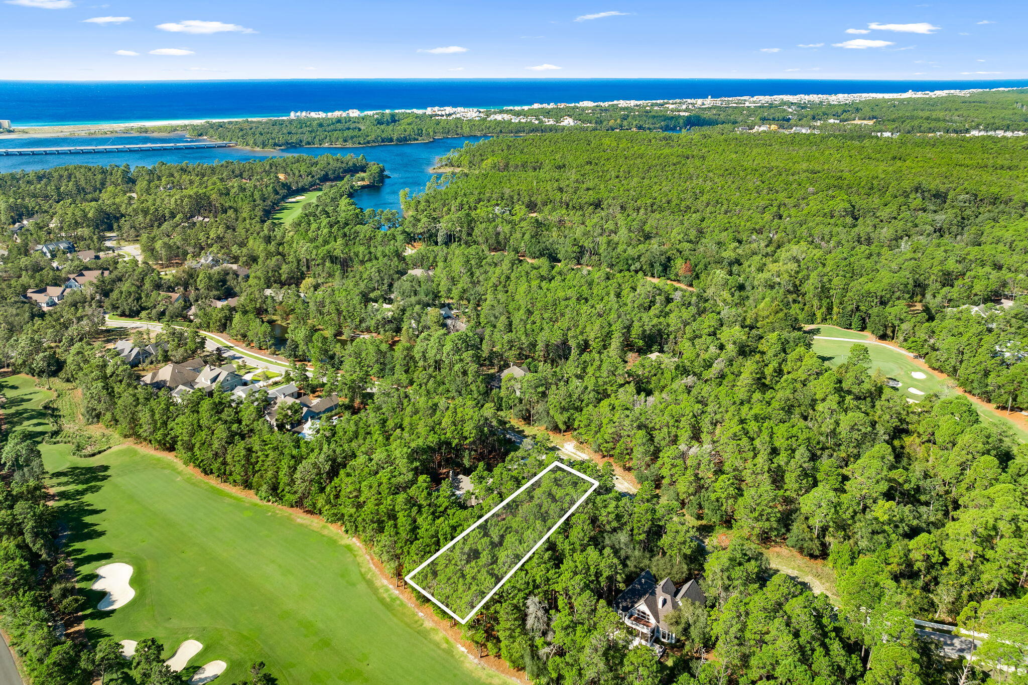 Discover the perfect opportunity to build your dream home in one of Northwest Florida's most exclusive gated communities. This premium homesite is nestled along the award-winning Shark's Tooth Golf Course on hole 10, offering stunning views and a serene natural setting. Wild Heron is located on the shores of Lake Powell—Florida's largest coastal dune lake. This property provides a rare blend of privacy, luxury, and access to the area's most breathtaking natural features.

Enjoy the lifestyle you've been dreaming of with access to world-class golf, pristine nature trails, and nearby white-sand beaches of the Emerald Coast. This community offers peace and security behind private gates, while still being just minutes from shopping, dining, and entertainment at 30A and Pier Park. Whether you're seeking a primary residence or a coastal retreat, this homesite offers endless potential to design the perfect custom home surrounded by nature and luxury.

Don't miss your chance to live where the golf course meets the coaston beautiful Lake Powell at Shark's Tooth.