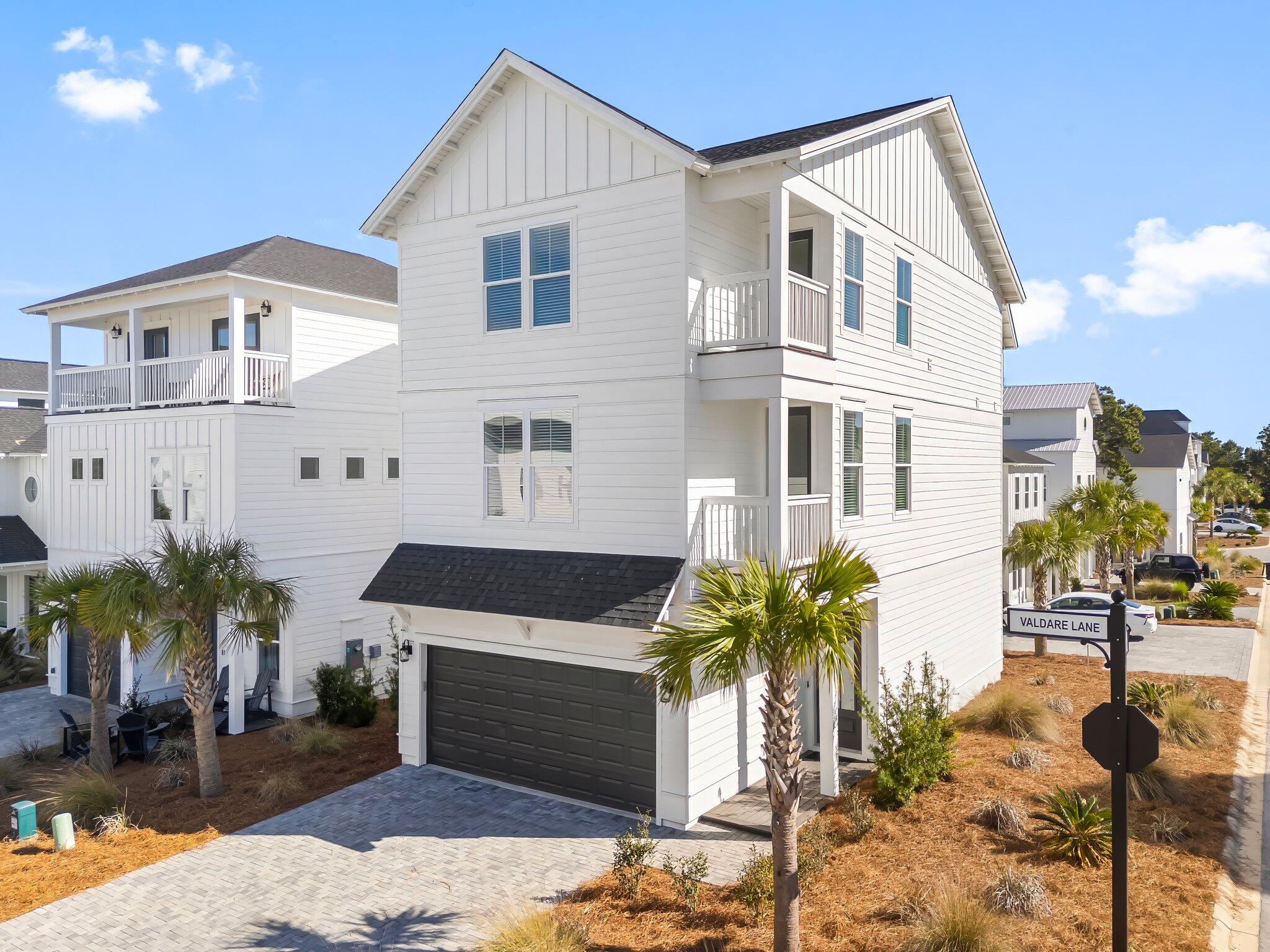 Immaculate, Never-Rented 30A Retreat - Furnished & Move-In Ready! Discover the perfect blend of luxury, comfort, and convenience in this stunning 4-bedroom, 4.5-bathroom coastal retreat. Nestled on a prime corner lot at the back of the neighborhood, this 2023-built home is in pristine condition—never rented and barely lived in as a second home! Thoughtfully upgraded and sold furnished, it's ready for you to enjoy immediately. Designed for both vacation rentals and multi-family getaways, the three-story layout provides exceptional privacy and flexibility. The 2nd and 3rd floors feature a master suite, guest bedroom, and an additional flex space—perfect as an office, bunk room, or loft—giving every guest their own retreat while sharing beautifully designed common areas. Step inside to find wood flooring throughout, no carpet! The chef's kitchen is a showstopper, featuring a gas cooktop, wine fridge, quartz countertops, and a whole-house water filtration system with filtered water at the sink. The bright, open-concept living space is anchored by an 85" smart TV, while both master suites and the office/bunk room boast 65" smart TVs. The loft and guest bedroom are equally equipped with 55" smart TVs, ensuring entertainment for all. 
Smart home technology adds ease and security, with a full security system, three cameras, a doorbell camera, an electronic front door lock, and dual-zone electronic climate control, all remotely accessible from your phone. Central heating and cooling (no split systems) ensure year-round comfort, and the two-car garage provides ample storage including a closet that could be used as an owner's closet. 
Located just half a mile from Walton County's largest public beach access and within walking distance to Donut Hole, 30Avenue, and Rosemary Beach, this home puts you in the heart of 30A's best dining, shopping, and beaches. 
Whether you're searching for a turnkey rental investment or a luxurious personal retreat, this exceptional property is a rare find!