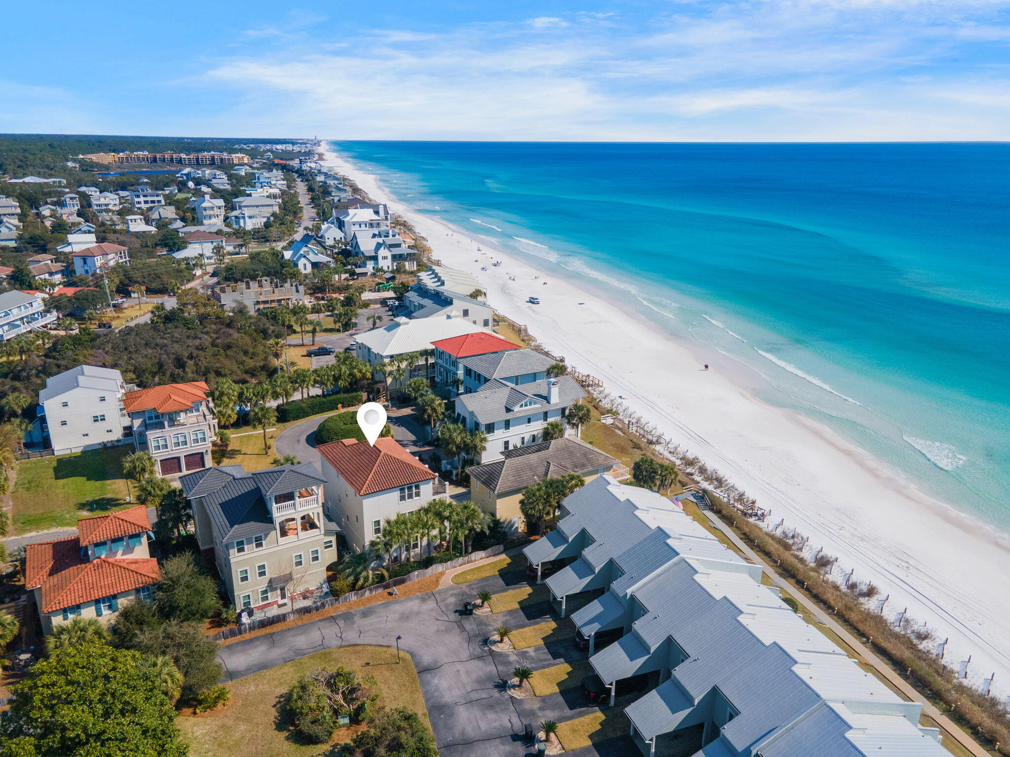 Welcome to Isla del Sol, a breathtaking 7-bedroom, 6-bathroom coastal escape nestled in the heart of Scenic 30A's Blue Mountain Beach community. This stunning three-story home accommodates up to 16 guests and offers unparalleled Emerald Coast views from expansive upper-floor balconies. With a premier location just one property back from the Gulf and a short distance to the community pool, Isla del Sol offers the perfect setting for a memorable coastal getaway.

Step inside to discover seamless indoor-outdoor living. The first floor features a spacious bunk room with two twin-over-full beds and direct access to a beautiful outdoor patio. Fire up the propane grill for alfresco dining beneath swaying palm trees, and take advantage of the laundry room with a full-sized refrigerator for added convenience. 

The main level of Isla del Sol is designed for gathering, with a bright and airy great room adorned with coastal-inspired décor, white-washed wood accents, and sea-blue hues. The gourmet kitchen boasts sleek black granite countertops, stylish blue cabinetry, and matching black appliances, creating a perfect blend of elegance and charm. A large dining table seats 12 guests, while the kitchen island doubles as a breakfast bar for 4ideal for morning coffee or casual snacks. Relax in the spacious living area with plush seating and a TV, or step onto the private balcony to enjoy breathtaking sunrises and sunsets. This floor also includes a guest bedroom, perfect for added privacy.

Upstairs, the top floor offers ultimate comfort and serenity with three beautifully appointed bedrooms. The primary suite features a private balcony, while two guest bedrooms share an expansive balcony with cozy seatingthe perfect spot to unwind and soak in the coastal breeze.

With on-site parking for 4 vehicles and 7 adult bikes included, guests can easily explore the nearby Timpoochee Trail and Point Washington State Forest. Whether you're looking to relax by the Gulf, bike scenic coastal paths, or simply enjoy time with loved ones, Isla del Sol delivers the perfect mix of comfort and luxury.