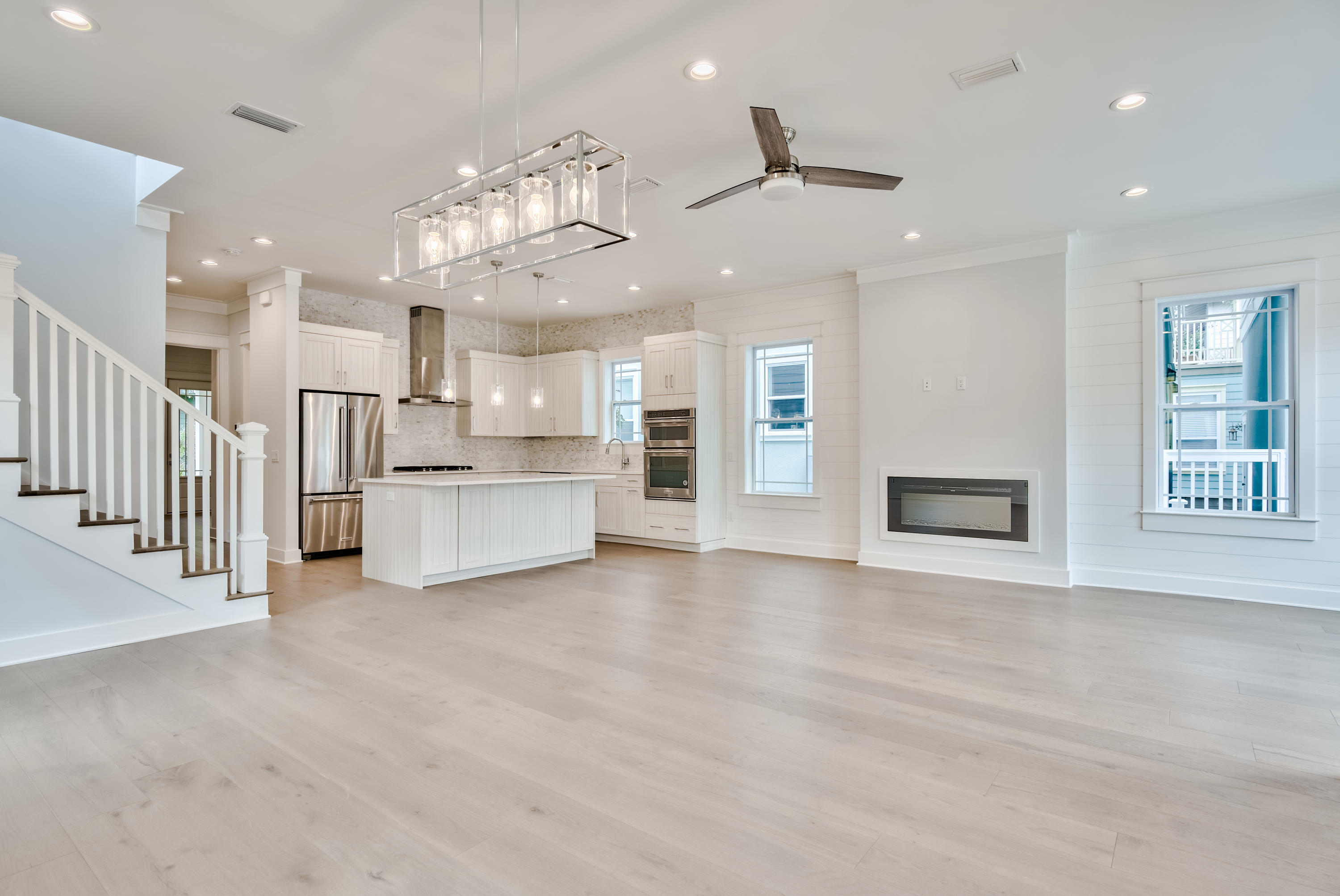 Newly completed construction by Bay Custom Builders, this beautifully designed beach house has a grand facade with porches on two levels. The entrance will invite you into a full-width living room with ample space for defined formal dining and living areas beneath an airy 10-foot ceiling. The open kitchen draws the eye with its tasteful cabinets and comprehensive range of fitted appliances. Tailor-made for gourmets and those who love to entertain, it boasts a 9-foot island which is sure to be a natural hub for hanging out or lingering over breakfast and pre-dinner cocktails. The hallway leads to a guest bathroom, laundry and master suite. The turning staircase leads up to an open entertaining area which would make an ideal second sitting room or play area. The well-planned second floor space includes a second master suite, two guest bedrooms and a practical bunk room fitted with six bunks - a fun space for youngsters to call their own. Discover your own favorite café for breakfast in the neighborhood or enjoy the dining, boutique shopping and entertainment just a few blocks from Rosemary and Alys Beach. The stunning white beach is just a short distance away for morning walks or fishing, and golfers are minutes away from Camp Creek Golf Club. In the opposite direction, Camp Helen State Park provides a natural environment rich in outdoor activities including birding, hiking, kayaking and fishing on Lake Powell.