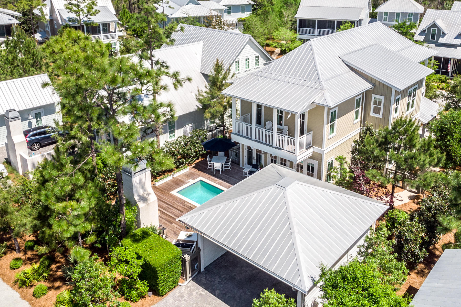 From the moment you step onto the grounds of this stunning Watercolor home, you will be amazed by the overall sense of privacy & attention to detail. The home has been meticulously maintained & is offered fully furnished. Built by Romair Construction, this home has had only one owner & has never been rented. No detail was overlooked in the design, it's finishes or it's beautiful furnishings. The breathtaking open concept great room offers abundant windows & natural light, a stunning state of the art kitchen & lovely dining area all overlooking the pool, fireplace and spectacular outdoor living oasis that is secluded by the addition of mature landscaping. Open the triple set of French doors in the great room & step outside to the saltwater pool relax by the outdoor fireplace or enjoy alfresco dining under the stars.  The first floor is complete with a junior master bedroom with en suite bathroom featuring a glass tiled shower and Carrera marble countertop, convenient "mud room" with built-in cubbie's and the under stair storage that has been converted to a conditioned wine room. 

Once you arrive upstairs, you will discover two additional guest bedrooms with en suite baths, a bunkroom hidden behind a custom made barn-door and the second powder bathroom. The generous master suite, with spa-like bathroom featuring marble countertops, gorgeous glass tile and beautiful lighting offers a walk-in master closet and a large covered balcony overlooking the pool area. 

Additional features include; Extensive upgraded landscaping has been added to the property to create natural seclusion and privacy, Cumaru hardwood on all porches and pool deck, Control4 smart home automation system covering select key areas for audio, lighting, security, an enlarged carport for 4+ cars with storage area, HVAC condensers upgraded to 15 SEER with sound blankets, HVAC evaporators are variable speed quiet units with humidity control and MERV-8 filtration. The salt water pool has a variable speed quiet pump, oversized filter and a gas heater for quicker heating. The attic area has been upgraded with open cell spray foam insulation creating a semi-conditioned space for improved access and storage. 

Located on 499 acres adjacent to the renowned South Walton Beaches and the town of Seaside, the Watercolor community was created with families in mind and offers the charm of small town life. Tucked between the beautiful white-sand beaches of the Emerald Coast and Western Lake, a 220-acre coastal dune lake, Watercolor is rich in natural beauty and offers exceptional community amenities which include a new gulf front beach club. This club will be the largest on 30A, featuring 3 pools with views of the gulf, a full-service restaurant and bar, new restrooms, an upper-level sunset viewing deck, and easy beach-to-pool access. The recently updated and expanded Camp Watercolor now offers a lazy river and water slides, multiple pools including a zero-entry children's pool, a huge park, a playground and basketball courts, lush green spaces, and food and beverage service. Enjoy miles of walking/bike trails, a boathouse on Western Lake with kayaking, canoeing and paddle boarding, multiple neighborhood pools, an outstanding tennis and pickleball facility -- all within short biking distance of the beach and the many shops and restaurants of Seaside. Every year since 2013, Watercolor Resort has received the Forbes' Four Star designation, making it the most decorated property in northwest Florida, and beginning in 2016, and every year since, the readers of Conde Nast Traveler have voted it the region's number one resort. With all the beautiful, newly updated amenities, now is the time to secure your spot in Watercolor.
