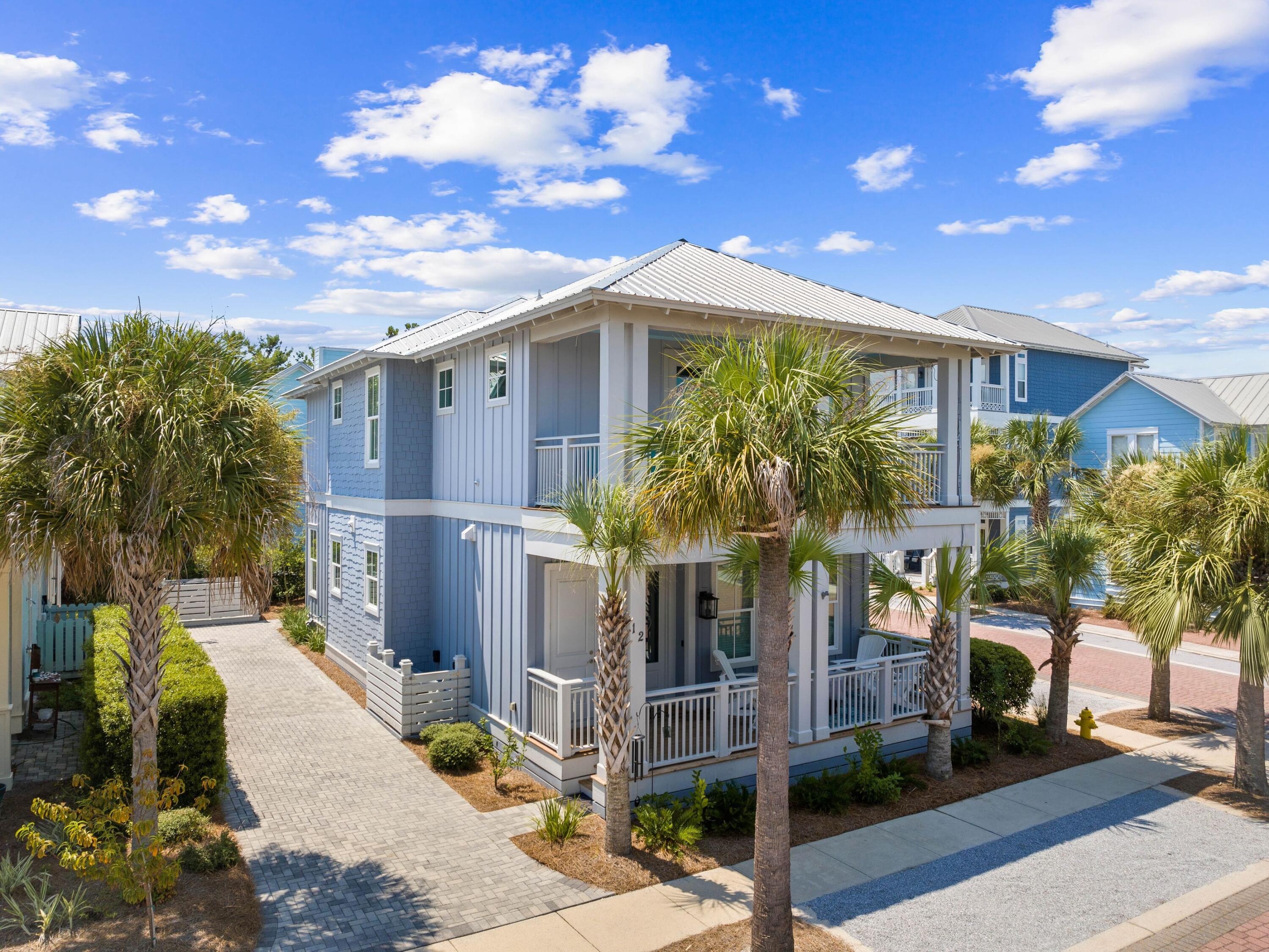 Welcome to your dream coastal retreat, nestled on a prime corner lot in the highly sought-after Seacrest Beach community. This stunning beach home, never rented and meticulously maintained by its original owners, offers the perfect blend of luxury, comfort and convenience. With four spacious porches, each equipped with misters and fans, this home is designed for outdoor living at its finest. This elegantly furnished property is ideal for a primary residence, vacation home or rental investment. Inside, you'll find exquisite fixtures and finishes, including polished hardwood floors and a gourmet kitchen with quartz countertops and high-end KitchenAid appliances. The open-concept living area is perfect for family gatherings, featuring an informal dining room that seats 10 and additional seating at the kitchen island, all beneath charming pendant lighting. The home boasts two master suitesone on each flooralong with a queen guest suite, a bunk room with built-in bunks and a second bunk room with a twin over queen. Every detail has been thoughtfully considered, from the generous laundry room to the ample outdoor storage space. The outdoor kitchen and expansive porches provide ample space for entertaining after a day spent at the largest community pool on 30A or the nearby deeded Seacrest Beach. With the convenience of tram service to and from the beach, 24-hour security, and easy access to Seacrest's shopping and dining, this property is truly a rare find. Additionally, the home's landscaping features six fruit trees, adding to the charm and appeal of this exceptional residence. This is a unique opportunity to own a piece of paradise in Seacrest Beach, where you can enjoy the perfect balance of tranquility, luxury, and proximity to all the best that 30A offers.