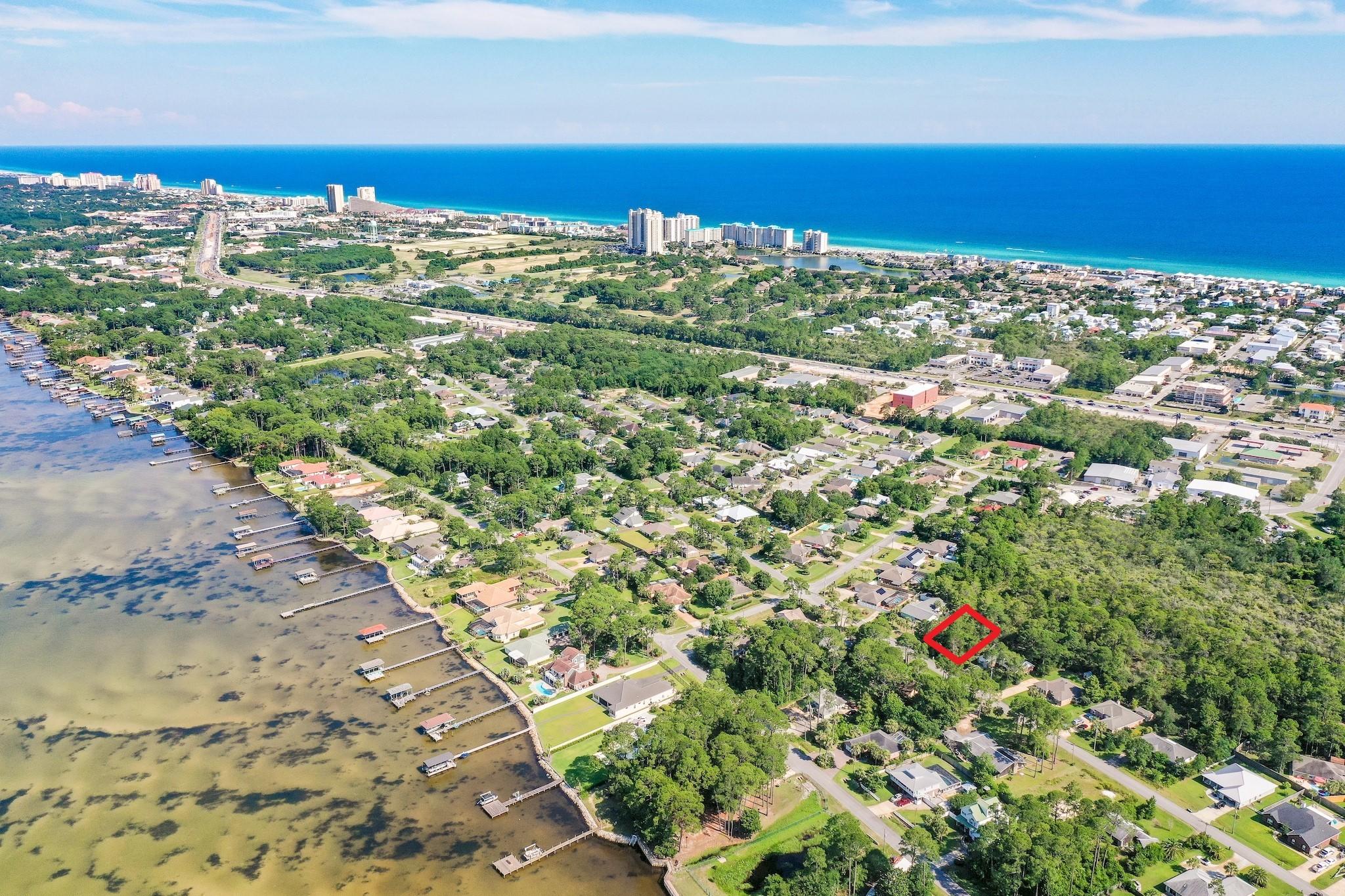 Build your dream home on this SPACIOUS LOT WITH TAP FEES PAID!! Just over a quarter acre (0.27) in the Holiday Shores Estates subdivision of Miramar Beach with NO HOA FEES! Lot 12 is perfectly located close to everything coastal living has to offer. It is right next to Emerald Bay Golf Club, Silver Sands Premium Outlets, within 1.5 miles to bayfront Legion Park which has a public boat ramp with access to Choctawhatchee Bay, and only 1 mile from the pristine beaches of the Gulf of Mexico which can easily be traveled by golf cart or bike right down Holiday Road. Build your dream home with no build out time or building restrictions and start living that coastal lifestyle you desire with boating, fishing, kayaking and paddle boarding just outside your door. Pompano Joe's is the closet beach access - a local's favorite!! Miramar Beach is centrally located between Destin and Santa Rosa Beach and offers premium shopping, fine dining and great entertainment to satisfy all your needs. Come discover what makes Lot 12 the perfect opportunity to turn your dream home into a reality!