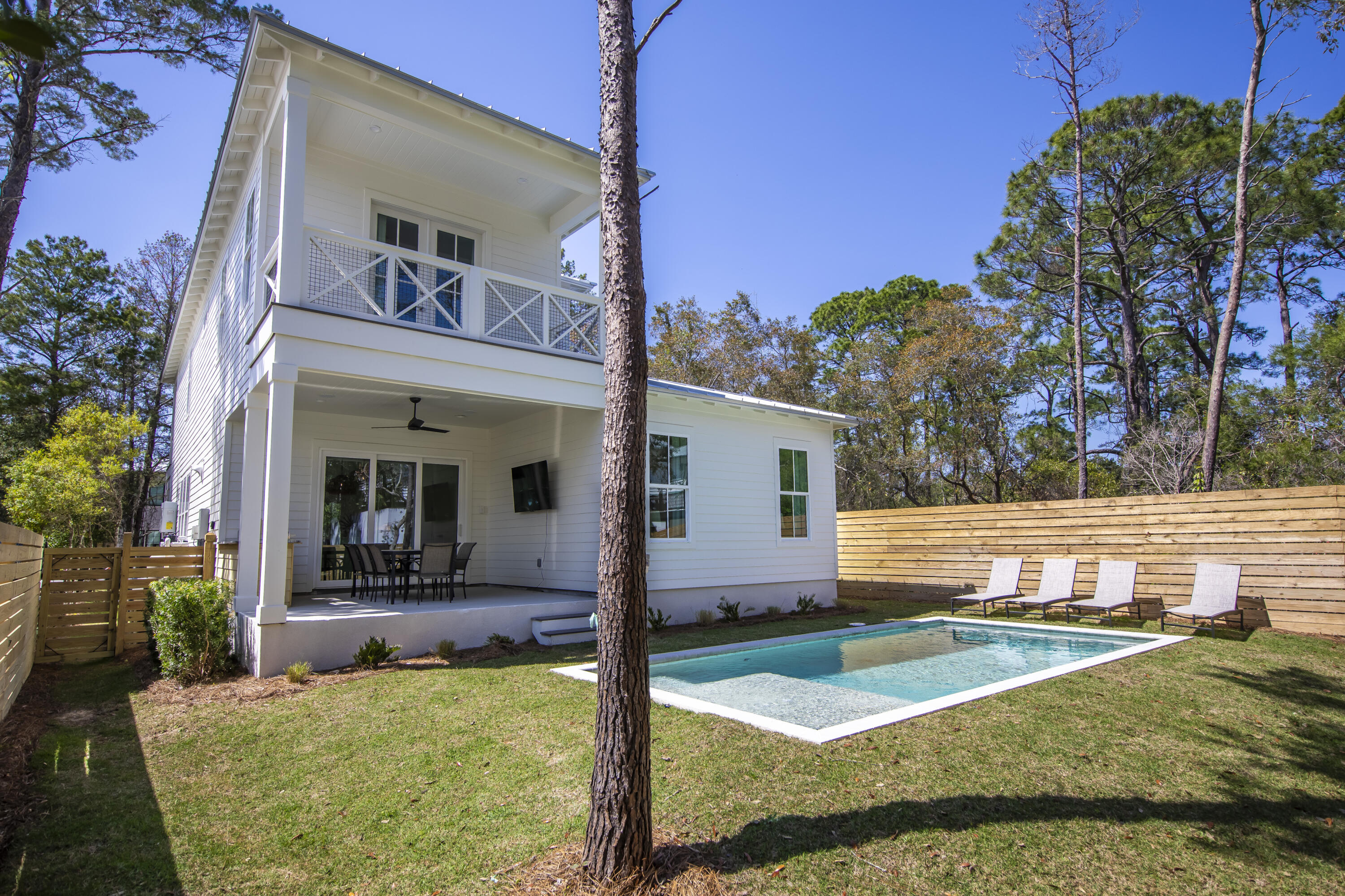 Discover your new sanctuary at 276 Clareon Drive, a fully furnished coastal haven just moments away from the enchanting beaches of 30A. Step into a luminous, open floor plan that effortlessly combines comfort and functionality exuding a welcoming ambiance. At the heart of this residence lies a gourmet kitchen, offering top-tier appliances, beautiful countertops, and abundant storage. With three generously proportioned bedrooms, each featuring its own en suite bathroom, and an expansive bunk area for additional guests or flex space. Venture outside to your private oasisan expansive lot offering year round play. The heated private pool and yard is sure to be a hit!